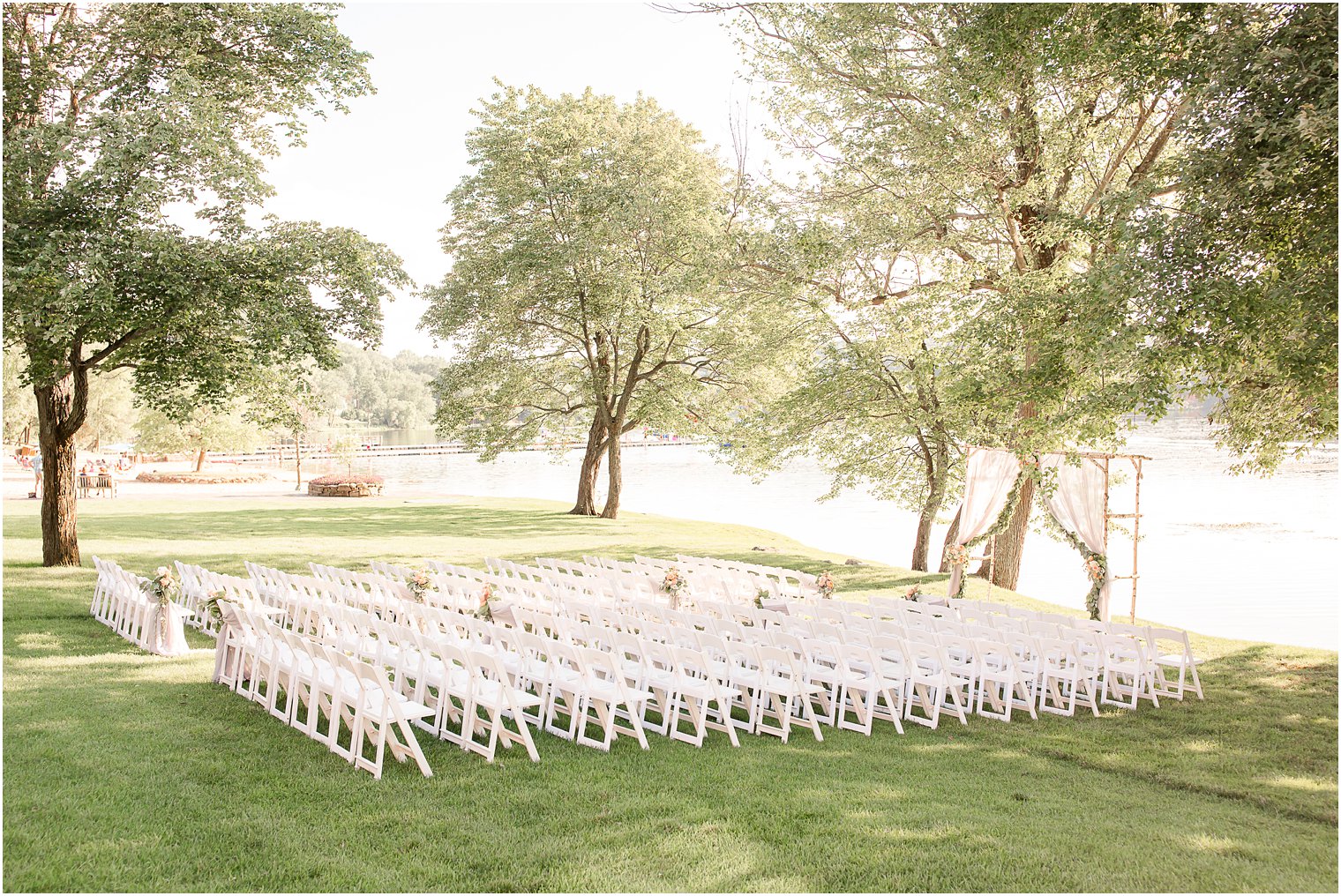 Wedding ceremony florals by Laurelwood Designs at Indian Trail Club