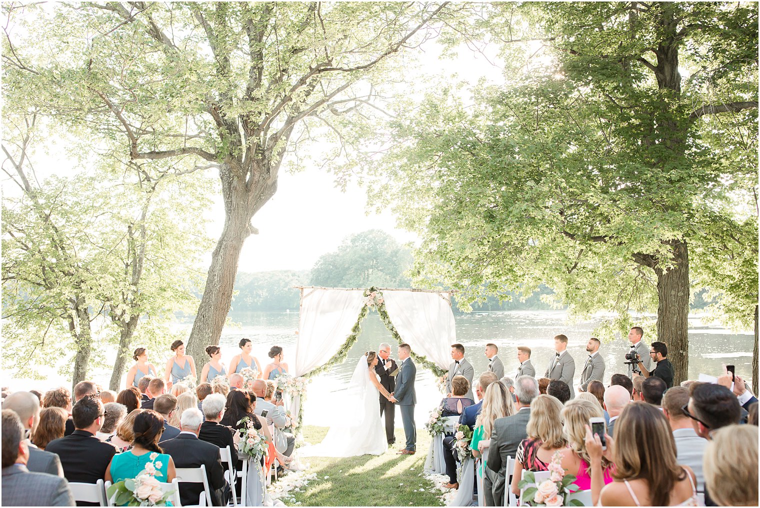 Wedding ceremony florals by Laurelwood Designs at Indian Trail Club