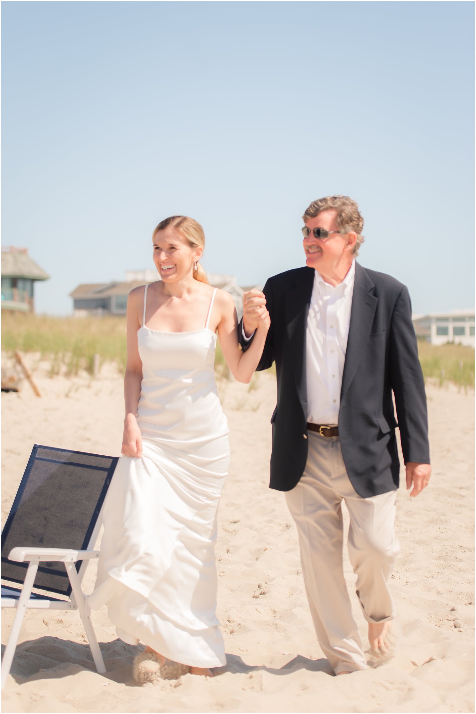 bride walking down the aisle with her father