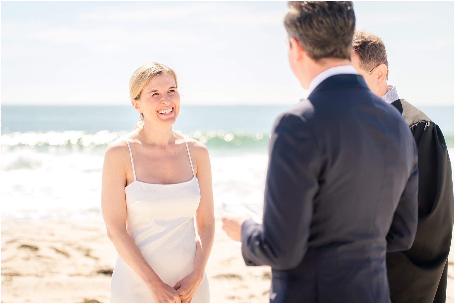 bride listening to groom say his vows