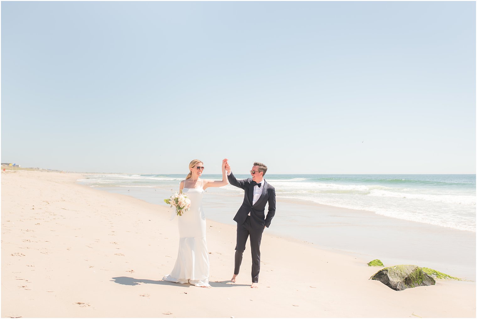 Bride and groom dancing on the beach on LBI