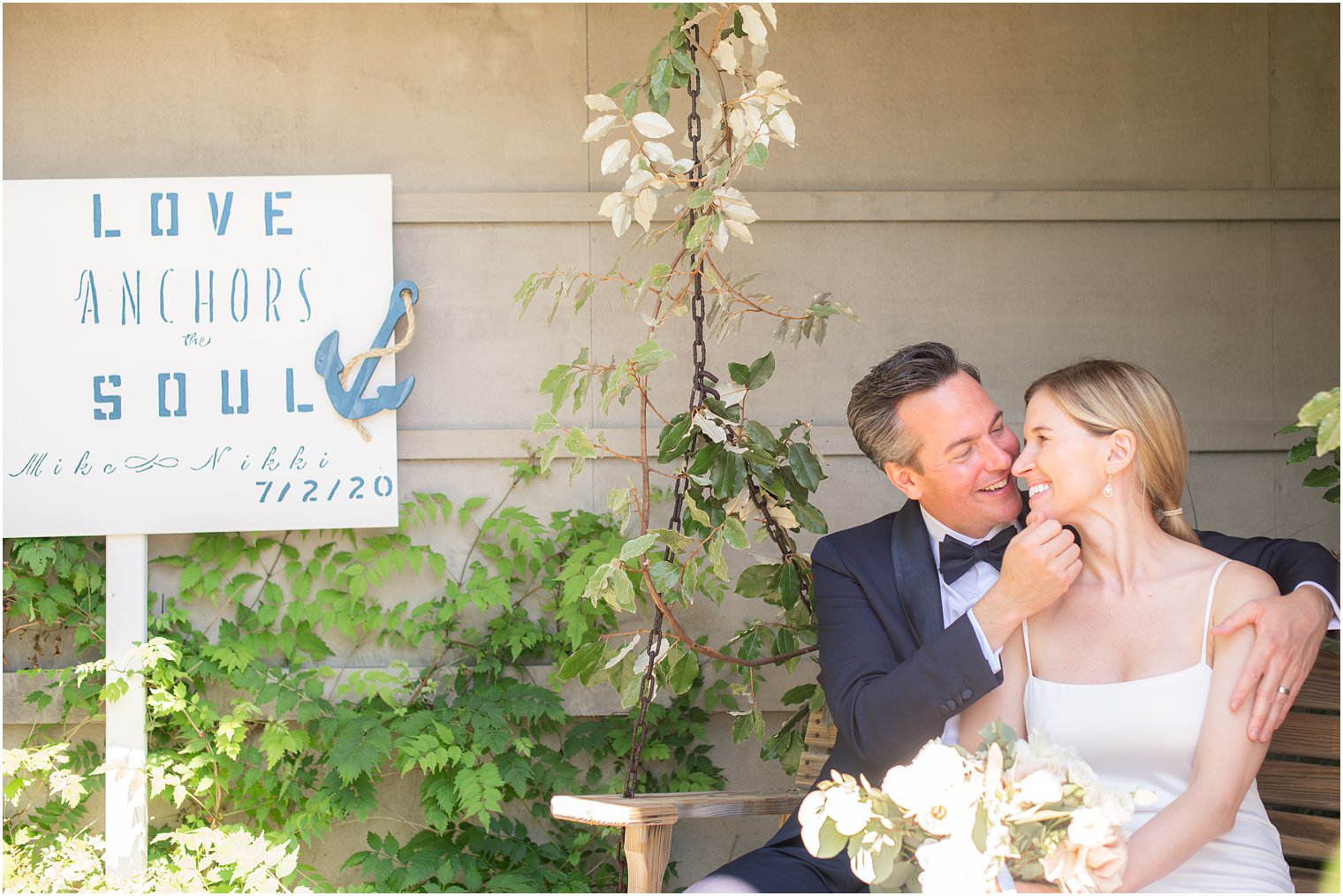 Bride and groom with welcome sign