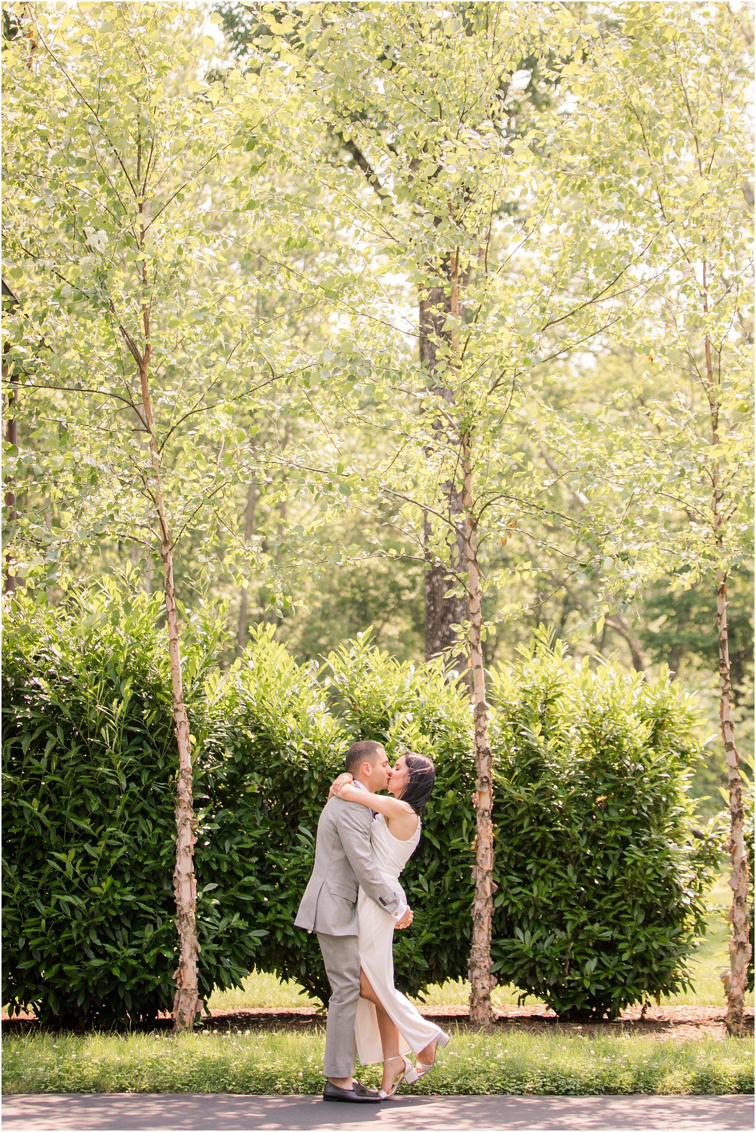 Groom lifting bride in woods of New Hope PA wedding