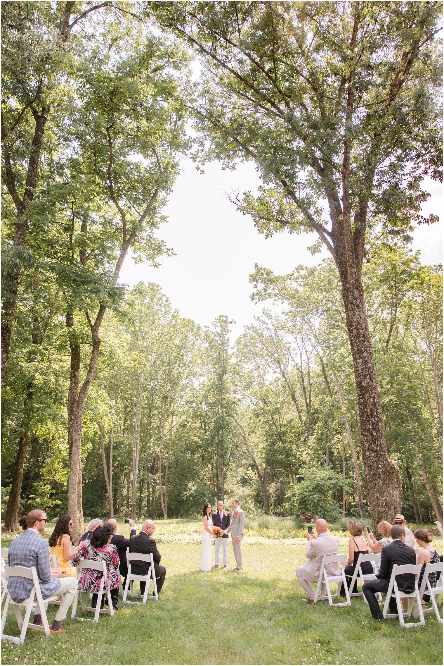 Intimate wedding ceremony under tree canopy in New Hope PA