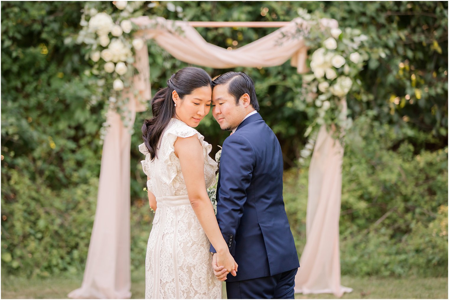 Intimate photo of bride and groom during backyard wedding