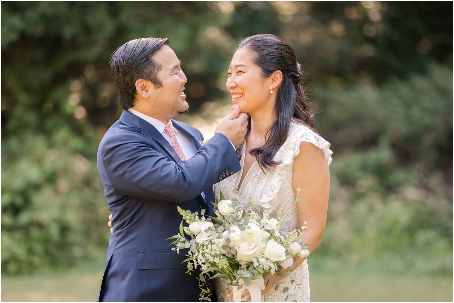 Sweet moment between bride and groom during backyard wedding