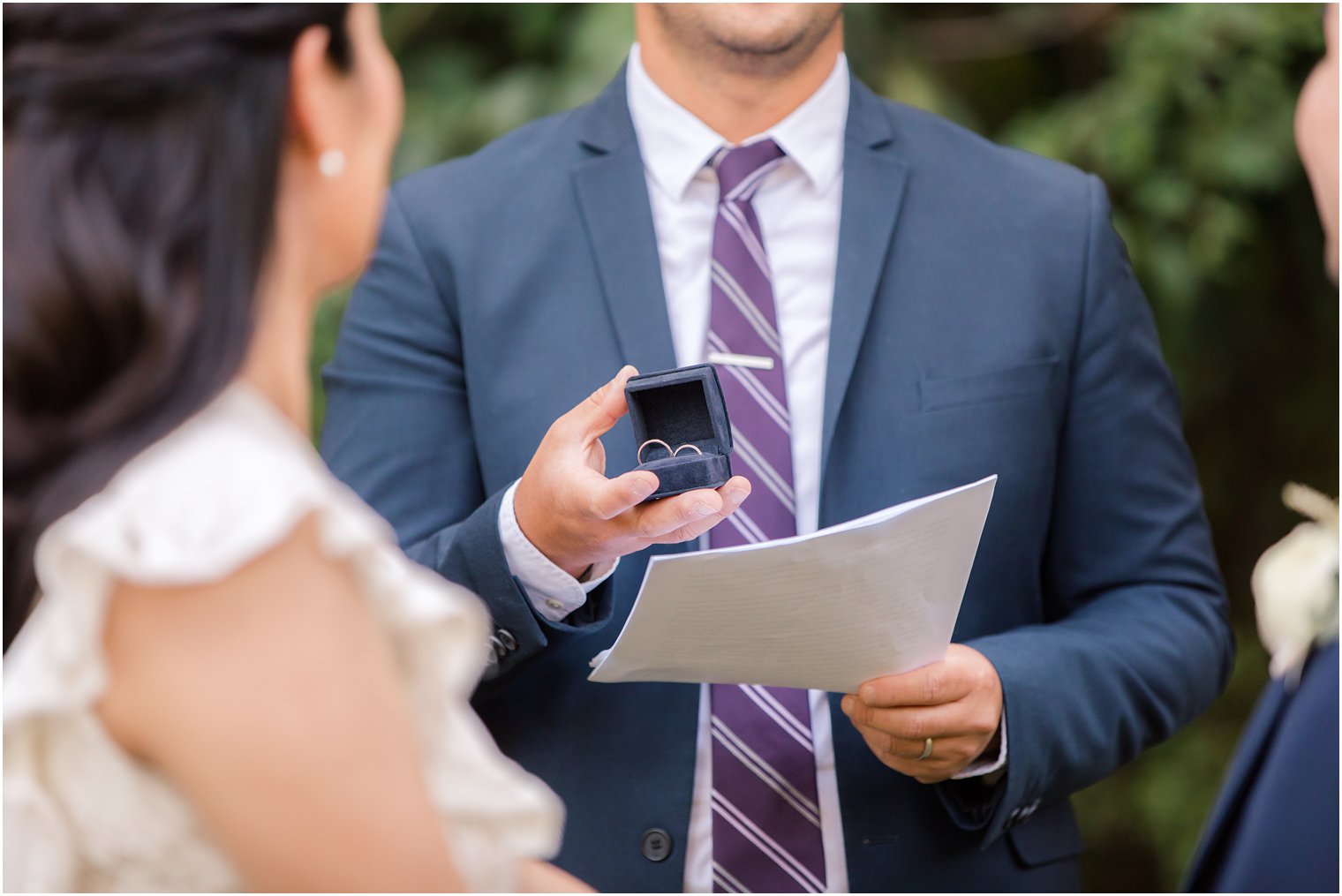 Officiant holding wedding bands