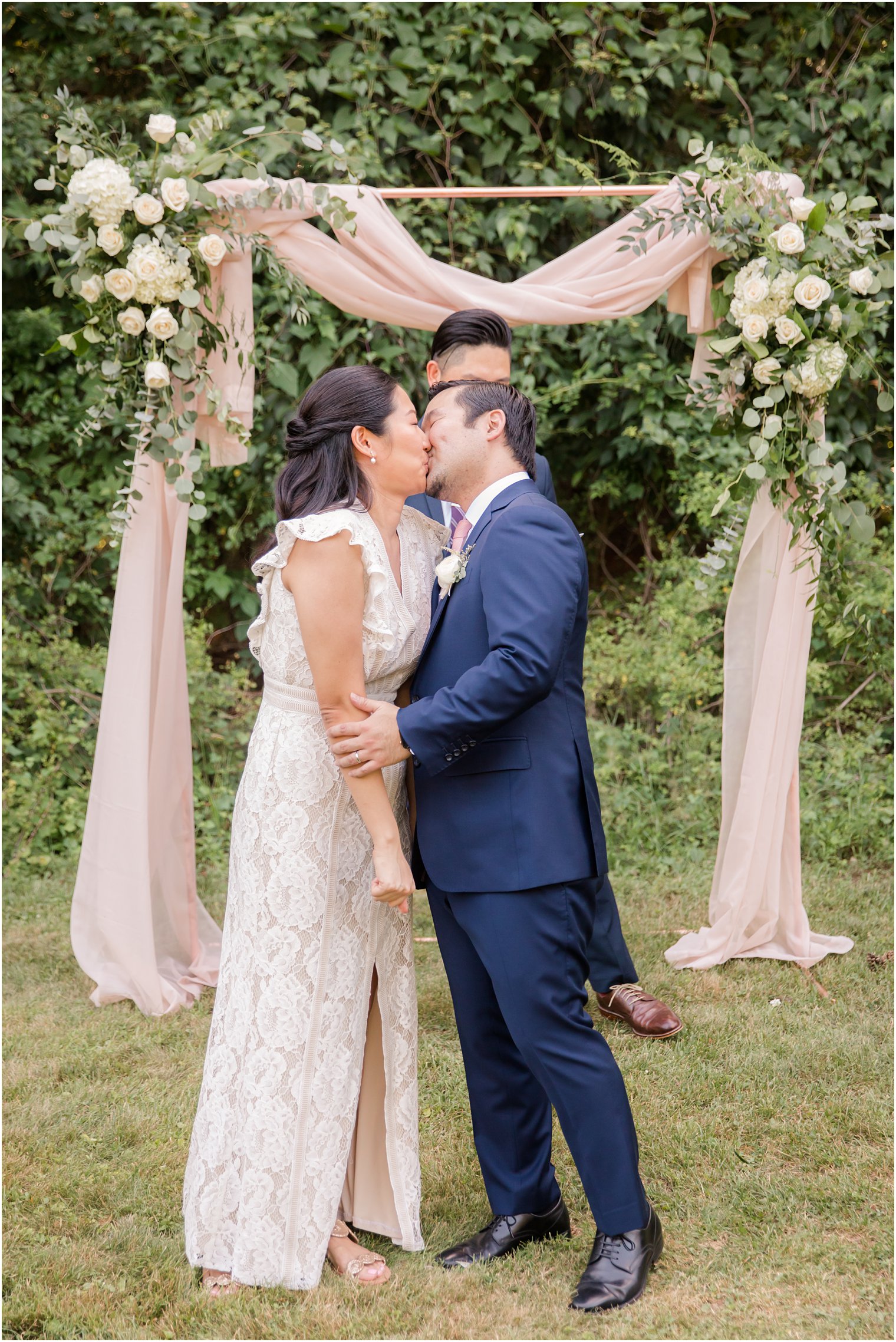 First kiss during NJ Intimate Wedding with a Gorgeous Arch by Idalia Photography