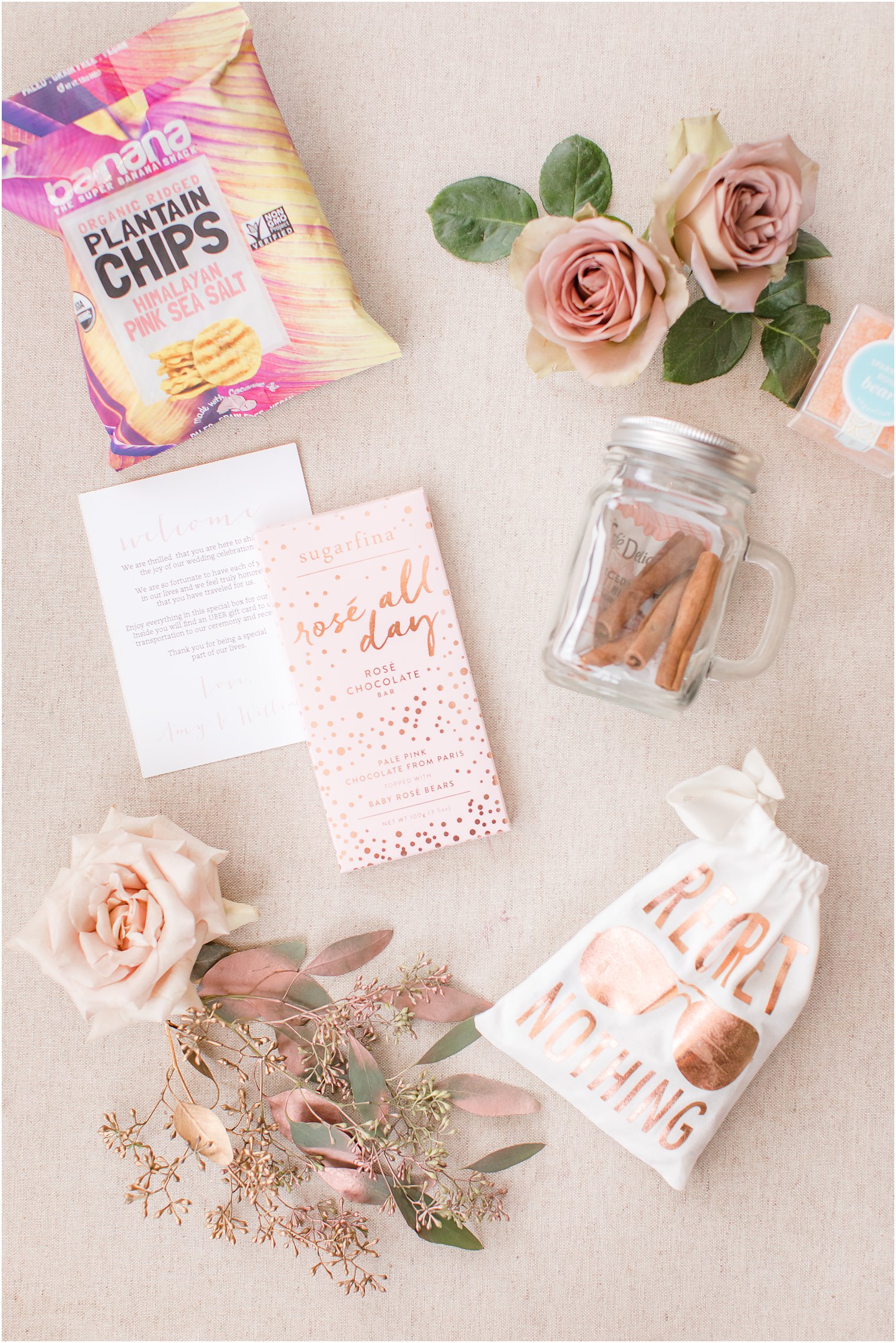 Wedding welcome bag with plantain chips, Sugarfina, and Regret Nothing bag