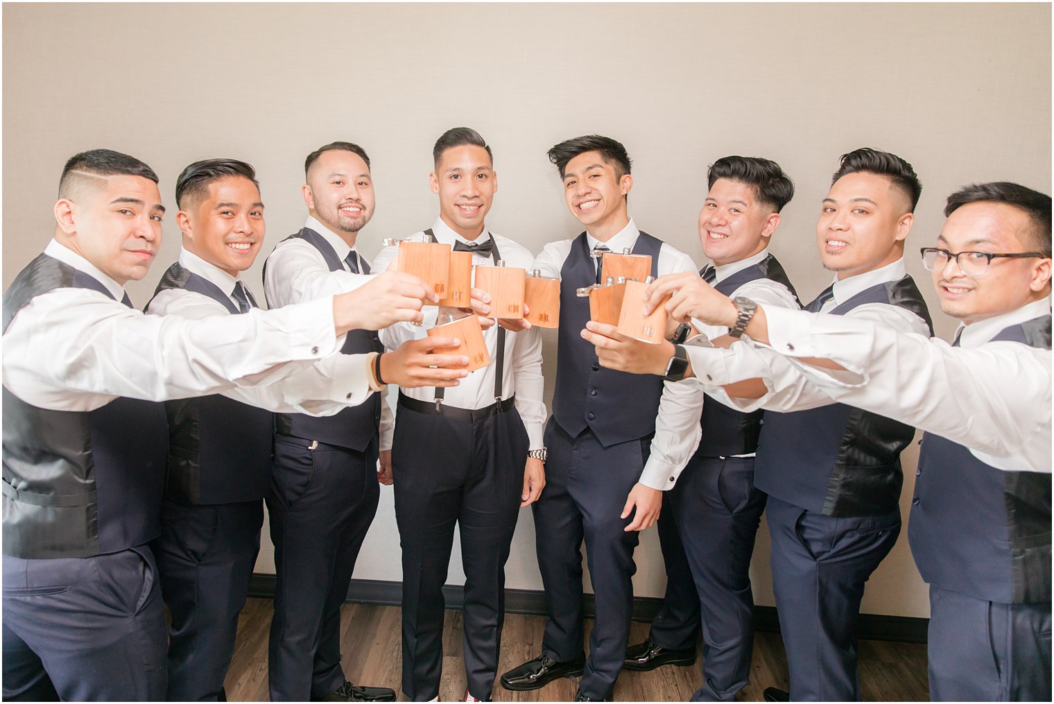 Groomsmen with monogrammed flasks