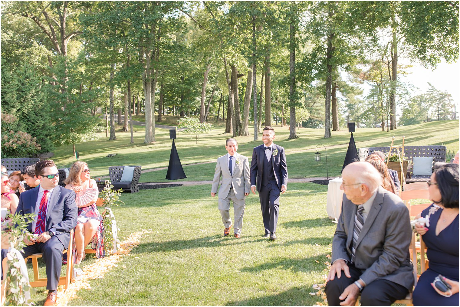 Groom processing during ceremony | Outdoor wedding ceremony at Ninety Acres at Natirar in Peapack NJ