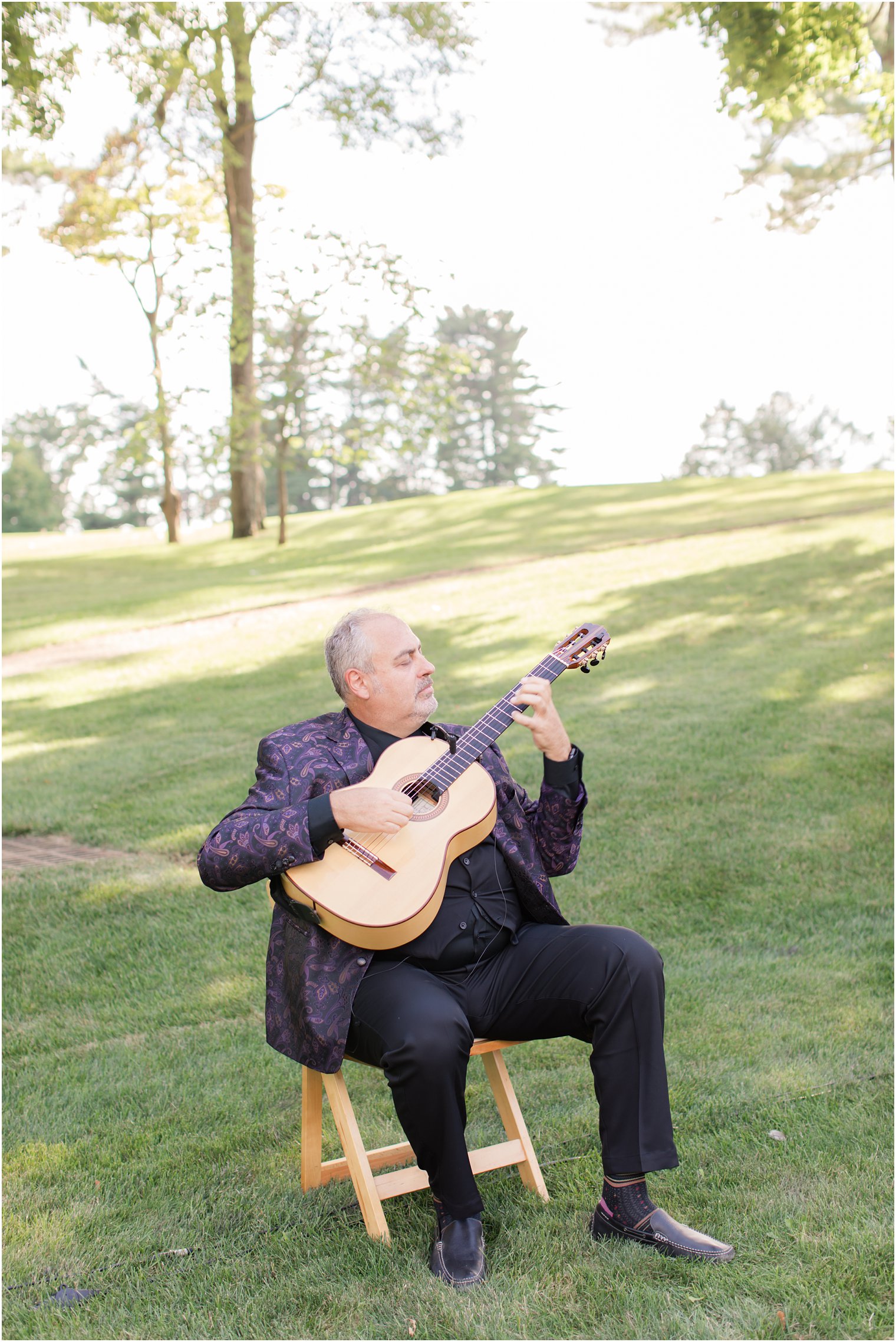 Guitarist at Outdoor wedding ceremony at Ninety Acres at Natirar in Peapack NJ