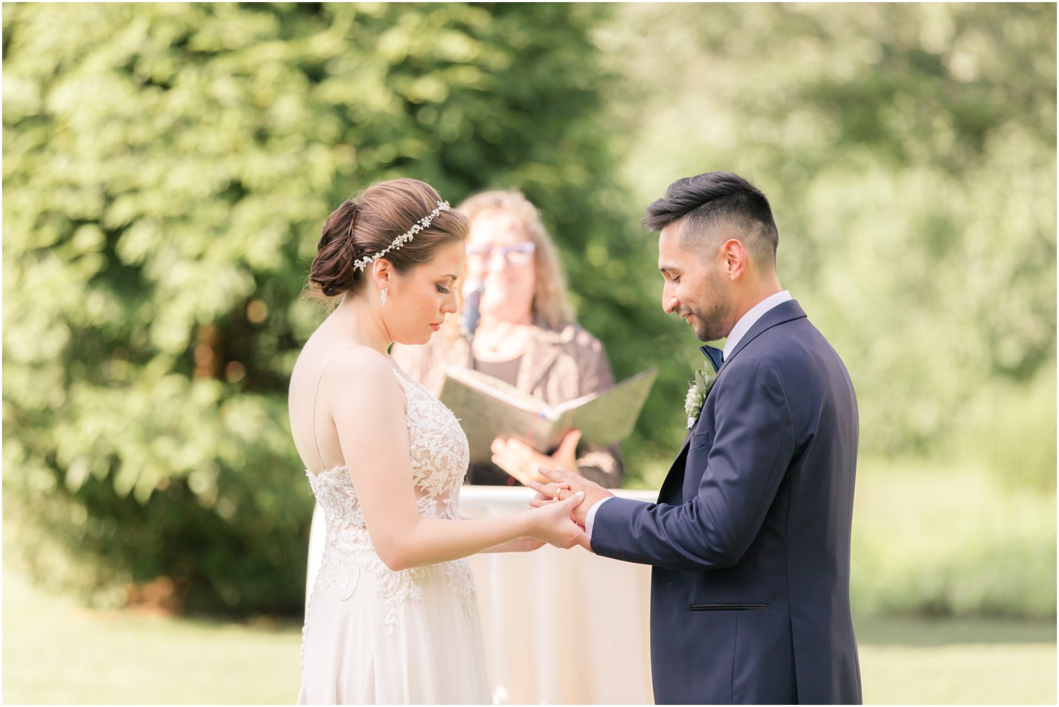 Ring exchange at Outdoor wedding ceremony at Ninety Acres at Natirar in Peapack NJ