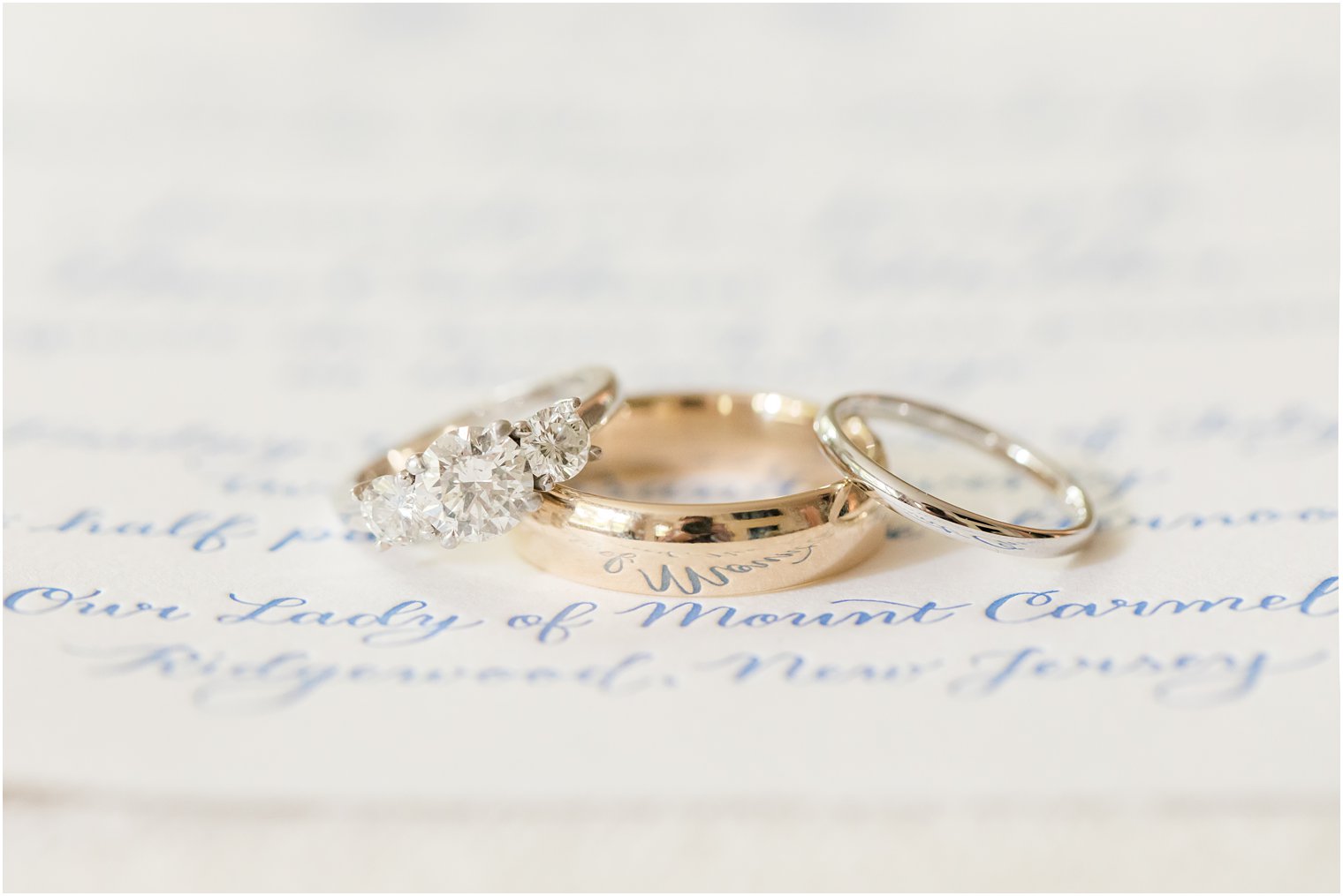 traditional wedding bands on letterpress invitation