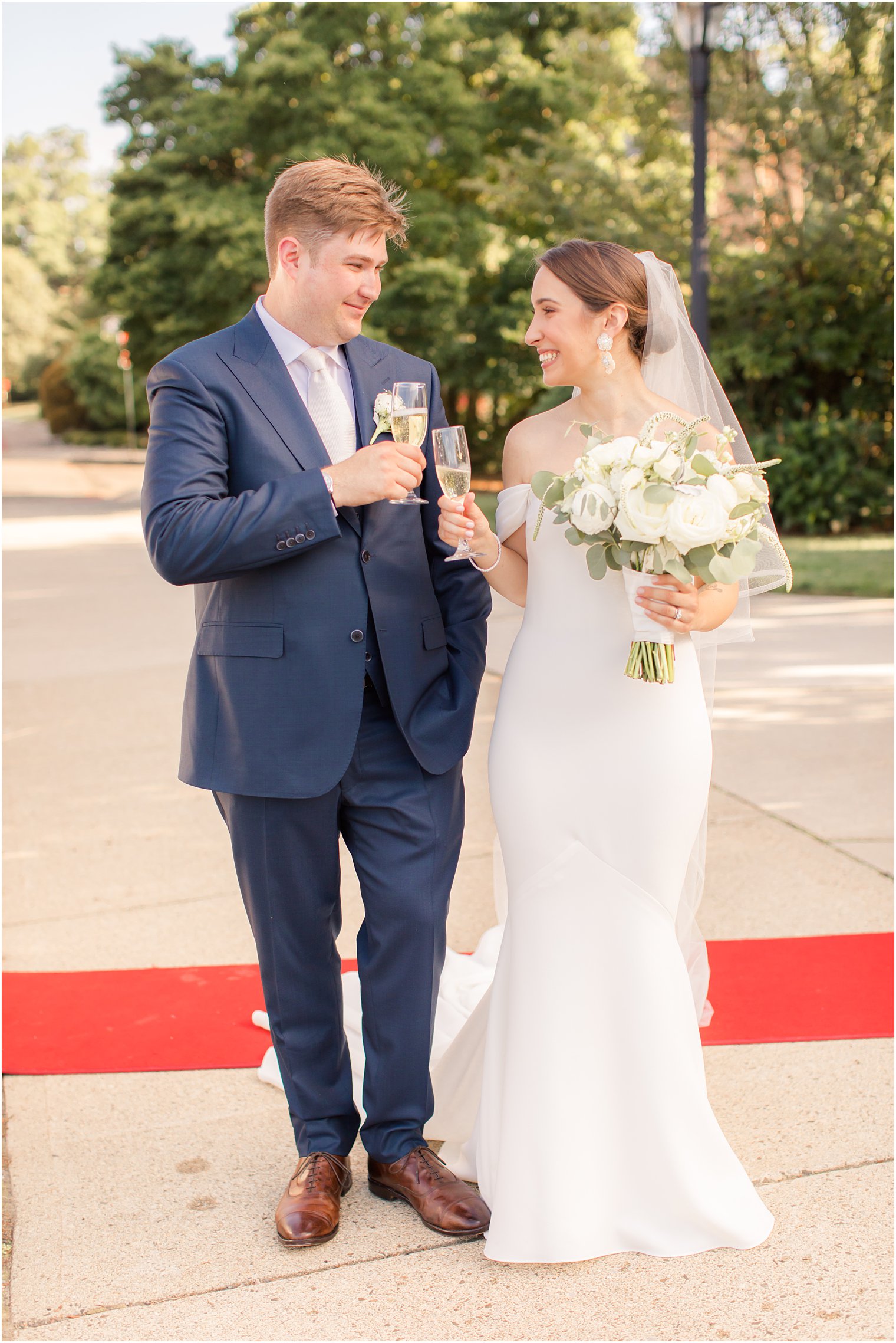 bride and groom toasting after wedding ceremony at Our Lady of Mount Carmel in Ridgewood NJ