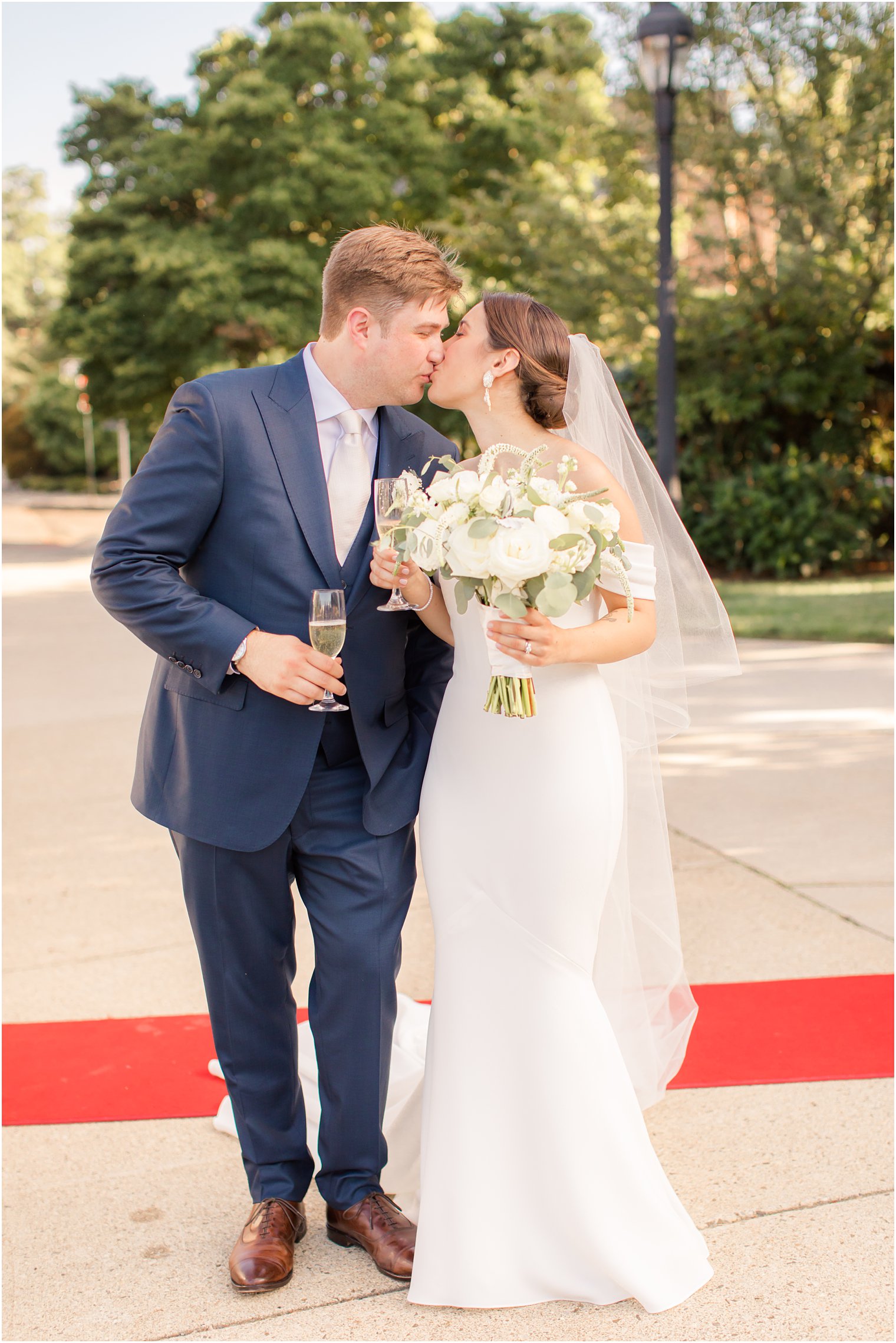 bride and groom toasting after wedding ceremony at Our Lady of Mount Carmel in Ridgewood NJ