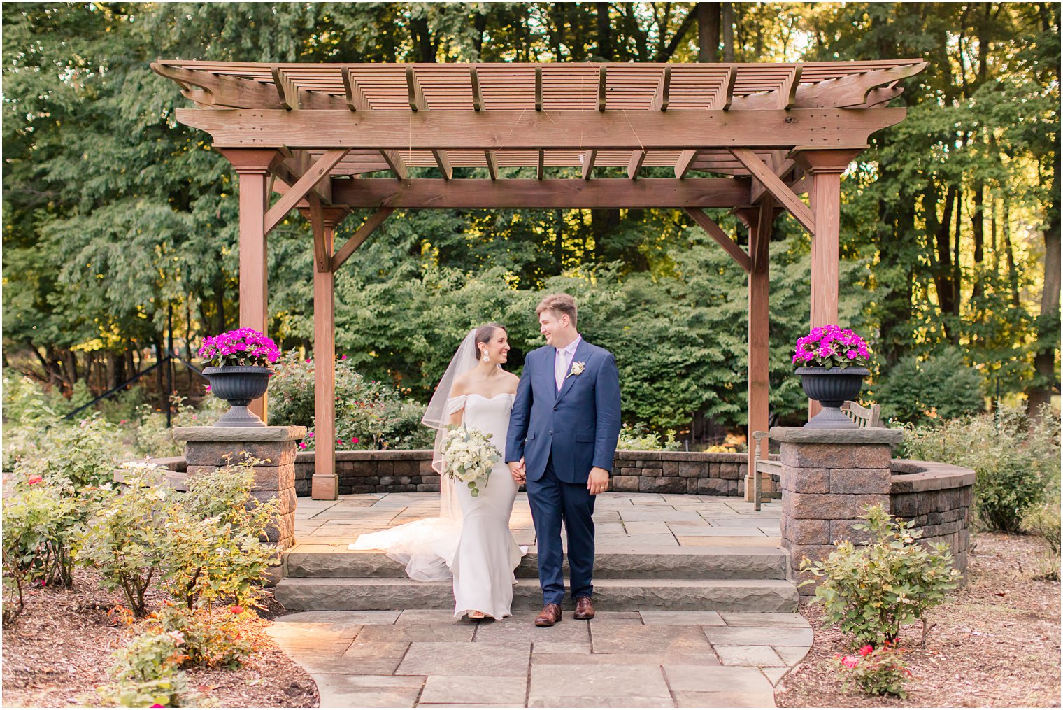 bride and groom walking at the Gardens of Wyckoff 