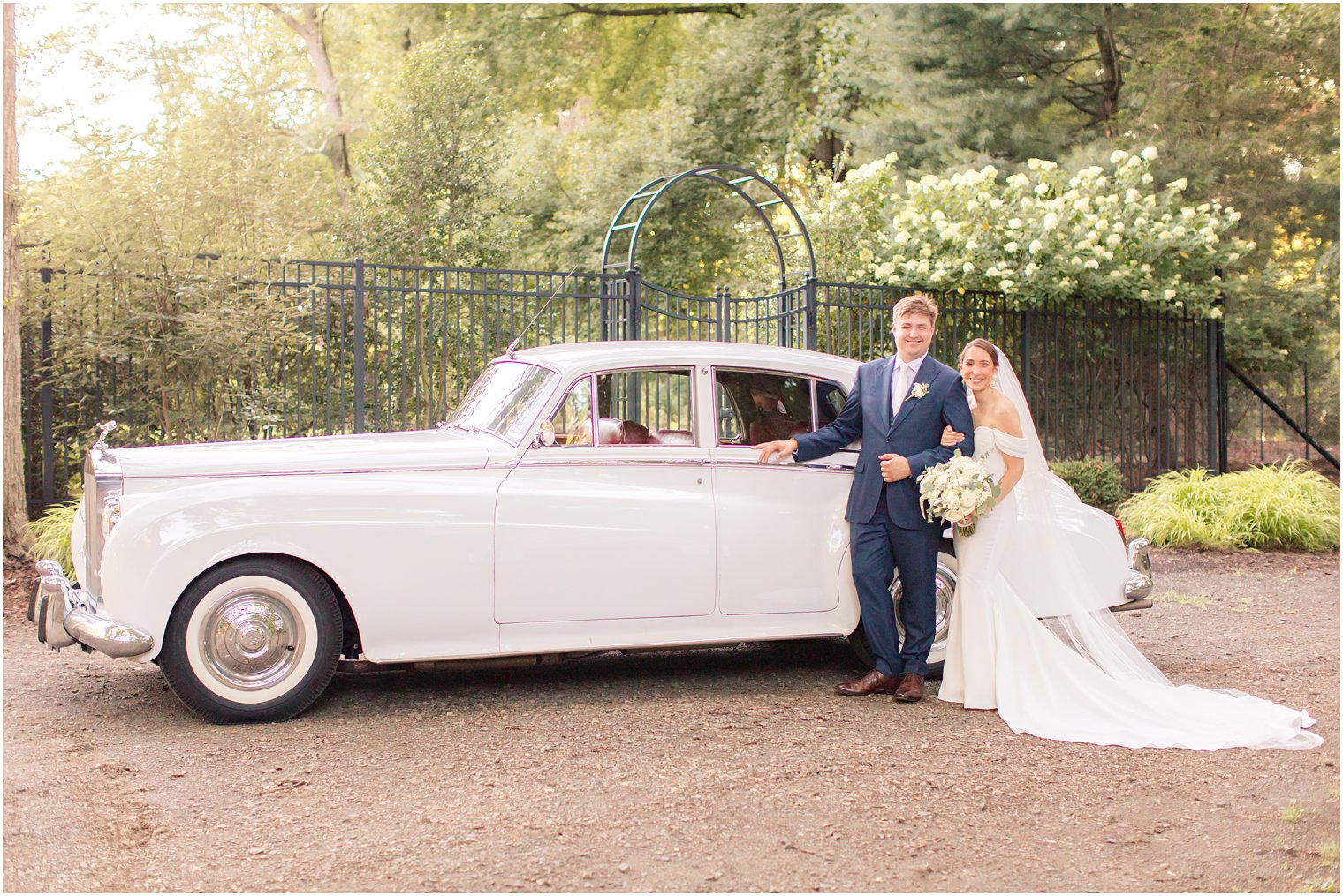 bride and groom with Rolls Royce at the Gardens of Wyckoff 
