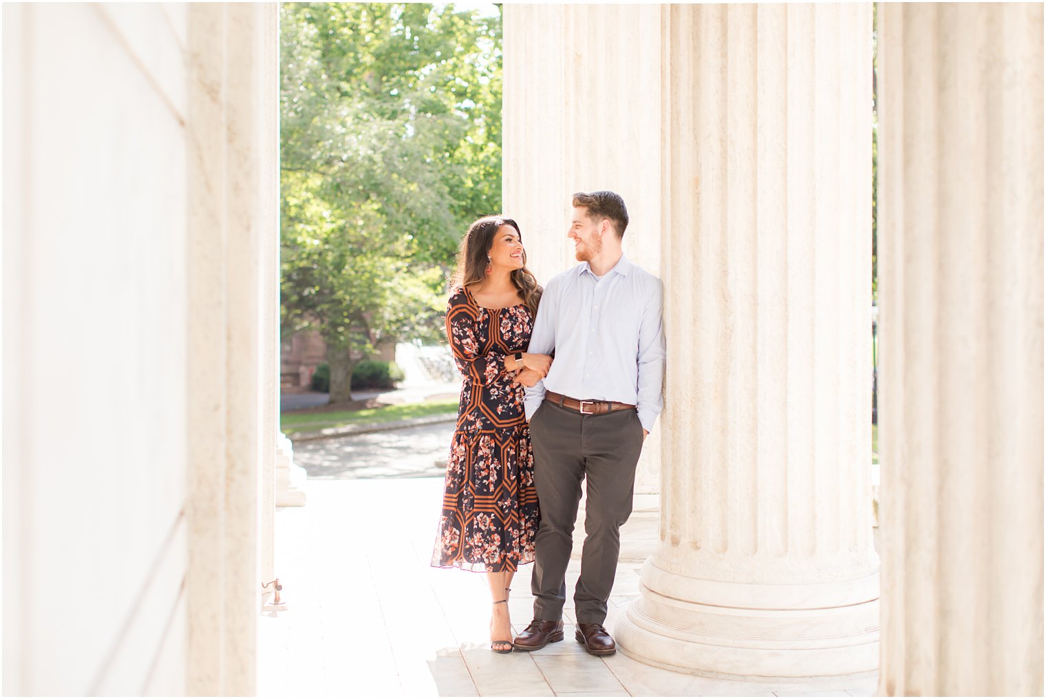 Engaged couple smiling at each other