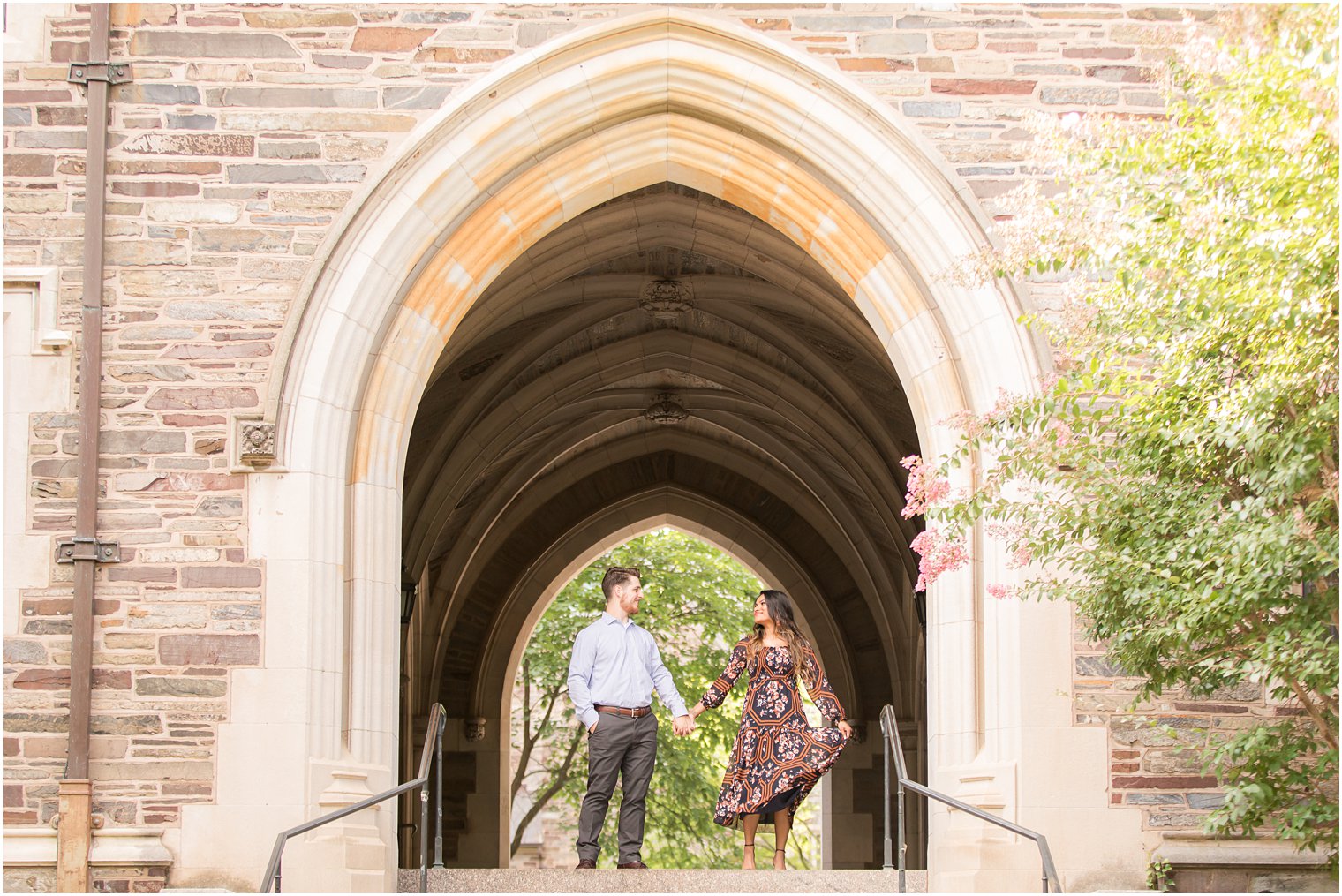 Groom twirling bride for engagement photos