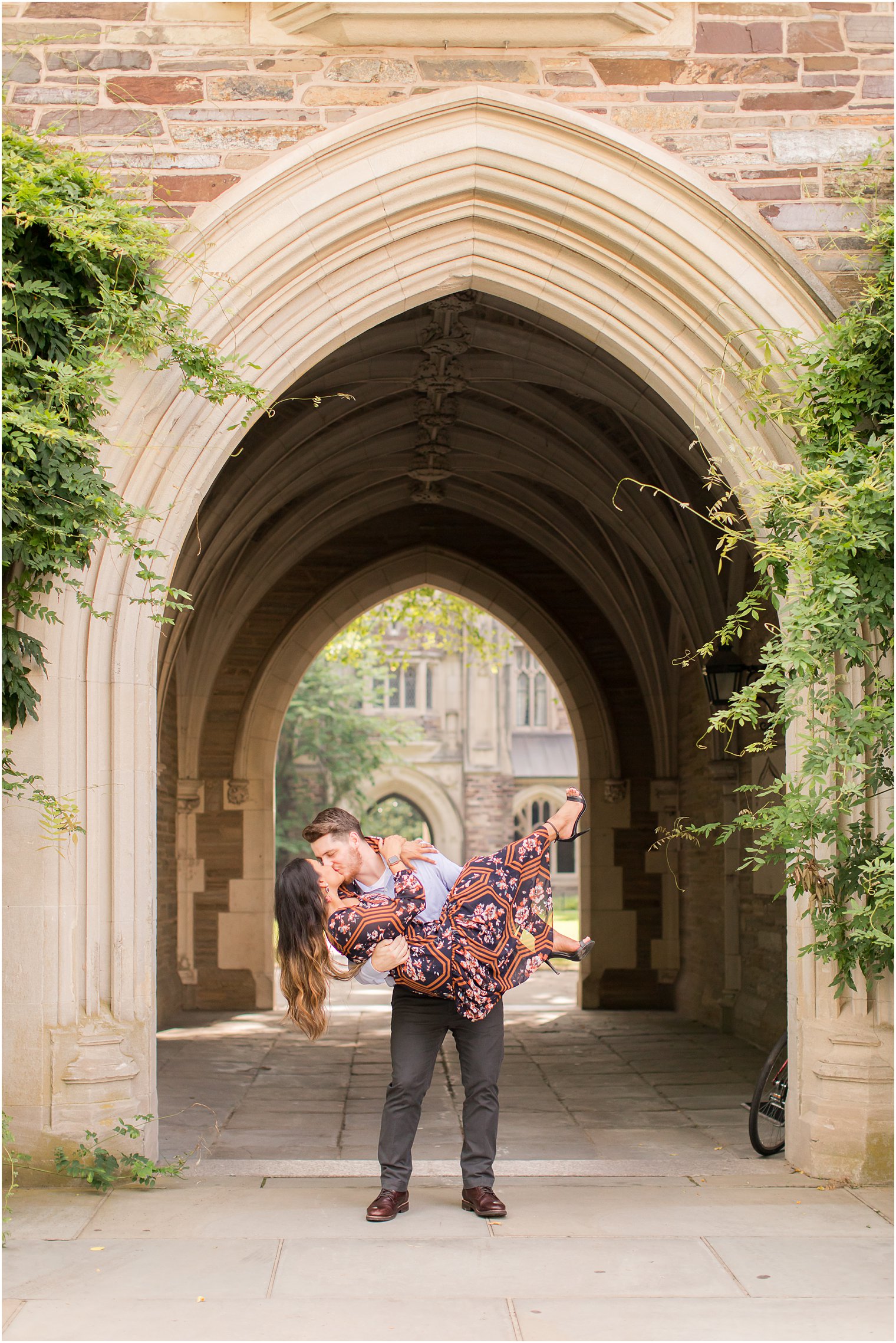 Groom lifting bride during Princeton University Engagement Session