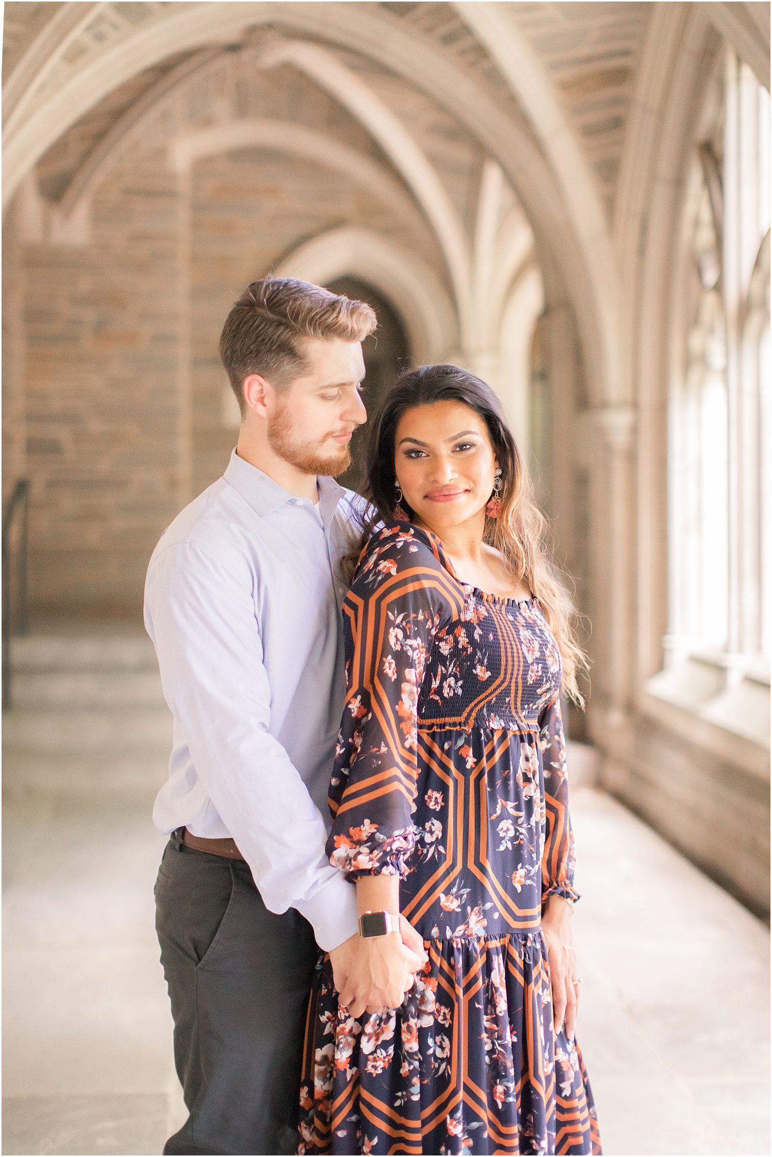 Bride and groom posing for engagement photos