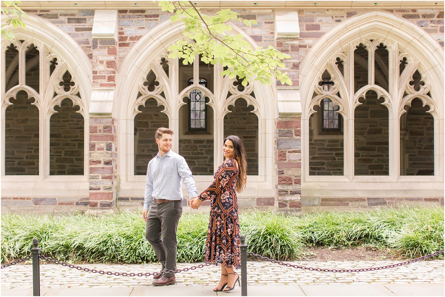 Bride and groom walking on Princeton campus