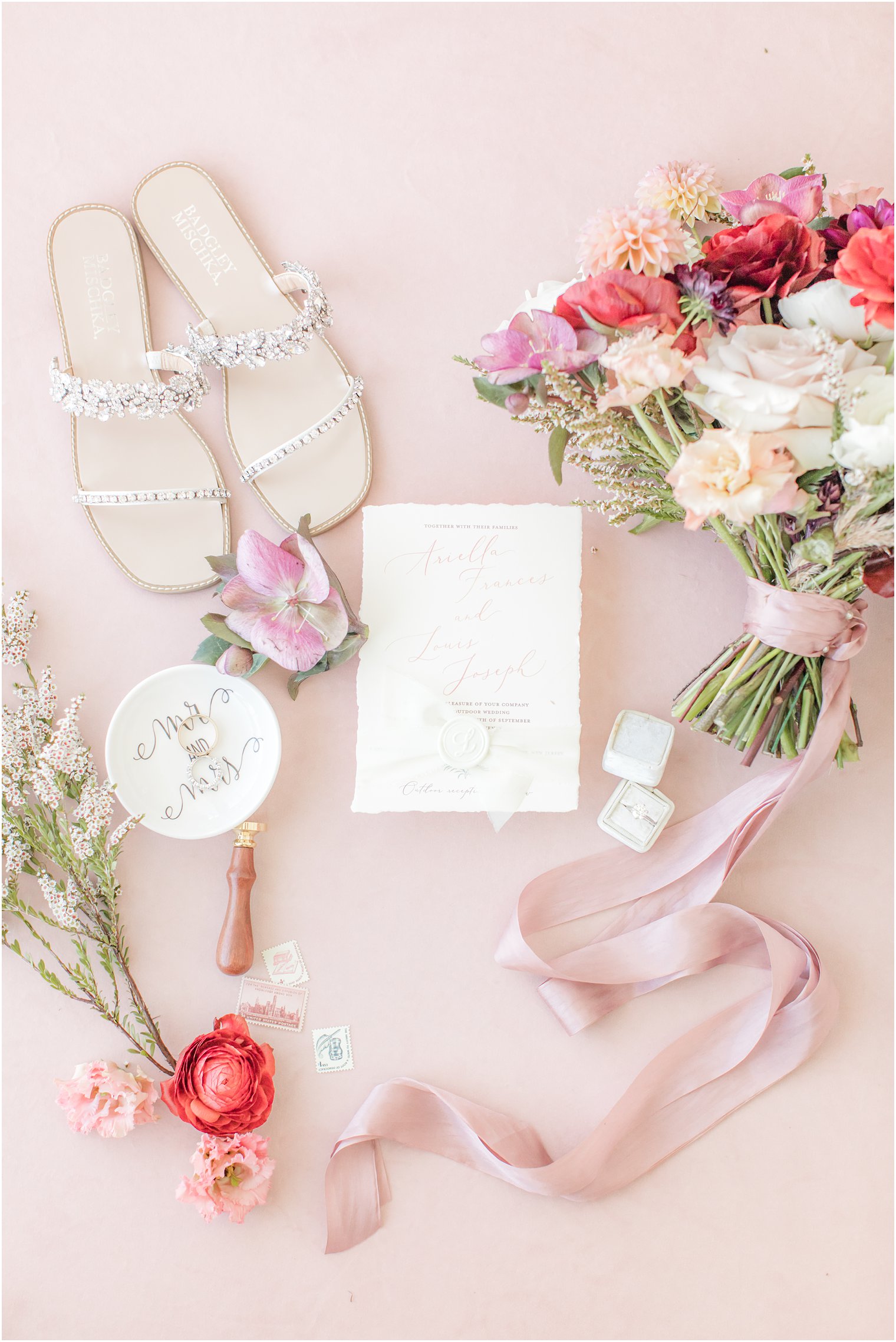 wedding details in pink flatlay