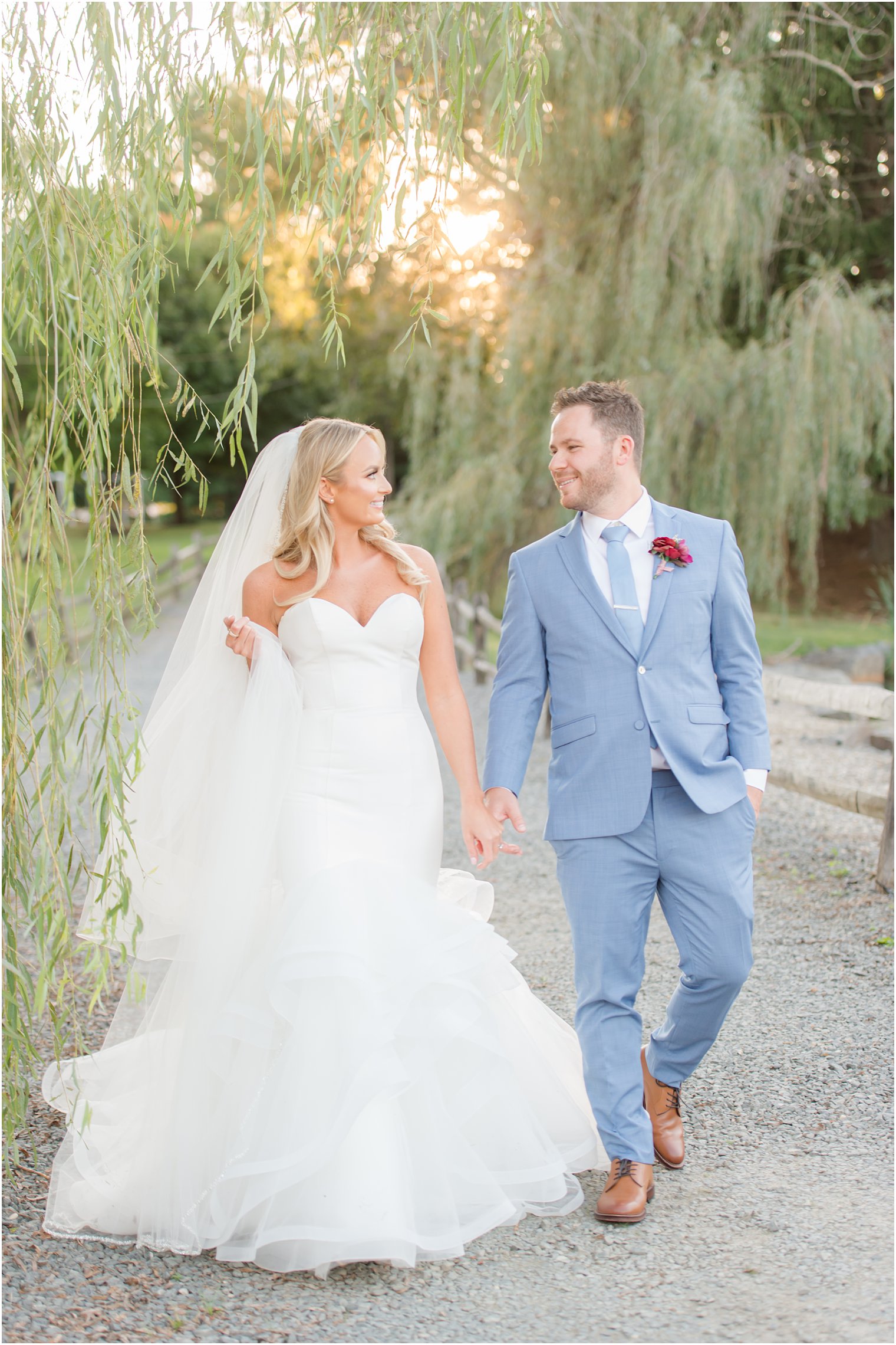 New Jersey newlyweds walk along path at Windows on the Water at Frogbridge