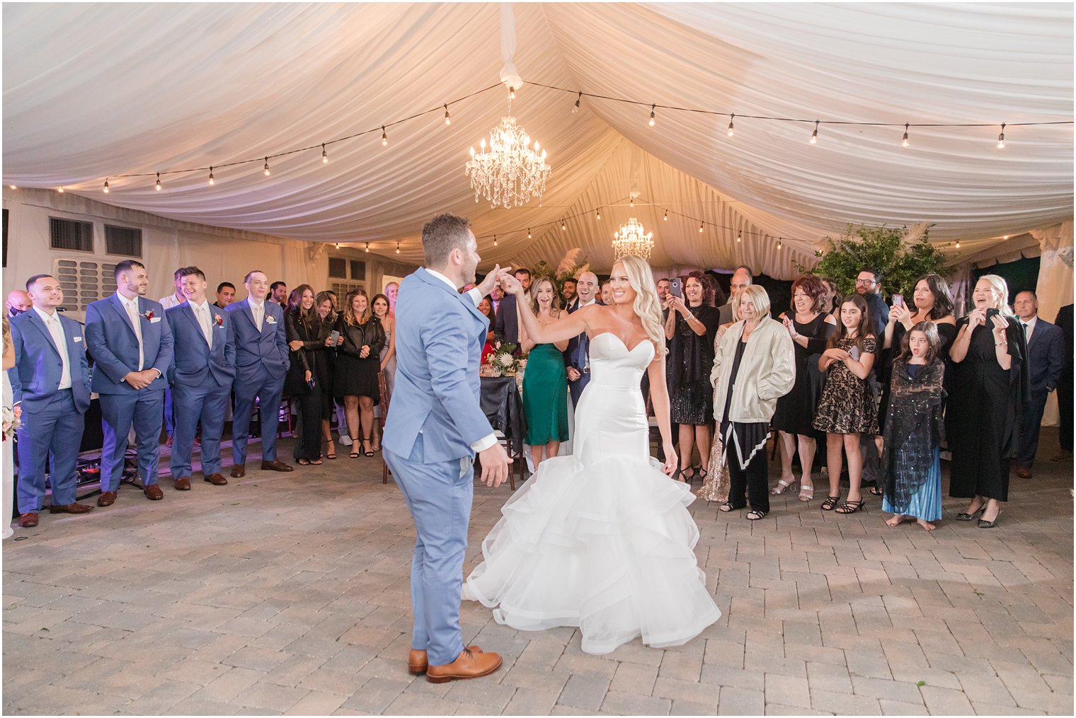 bride and groom dance under tent during Windows on the Water at Frogbridge wedding reception