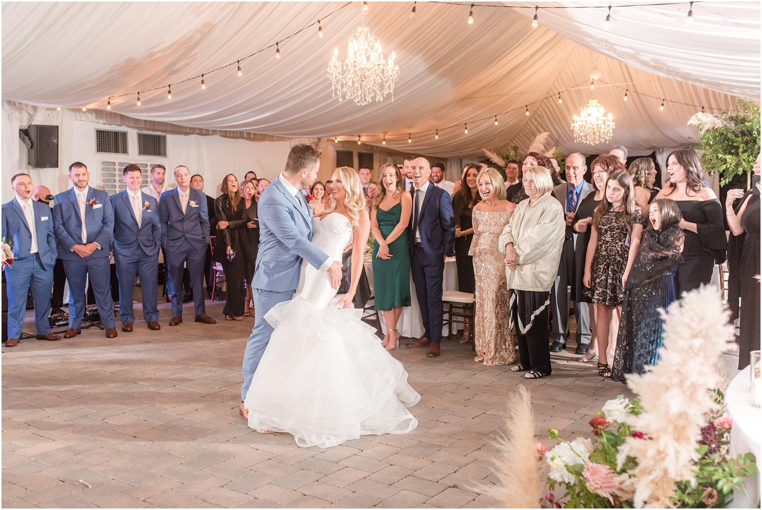 bride and groom dance under tent during Windows on the Water at Frogbridge wedding reception