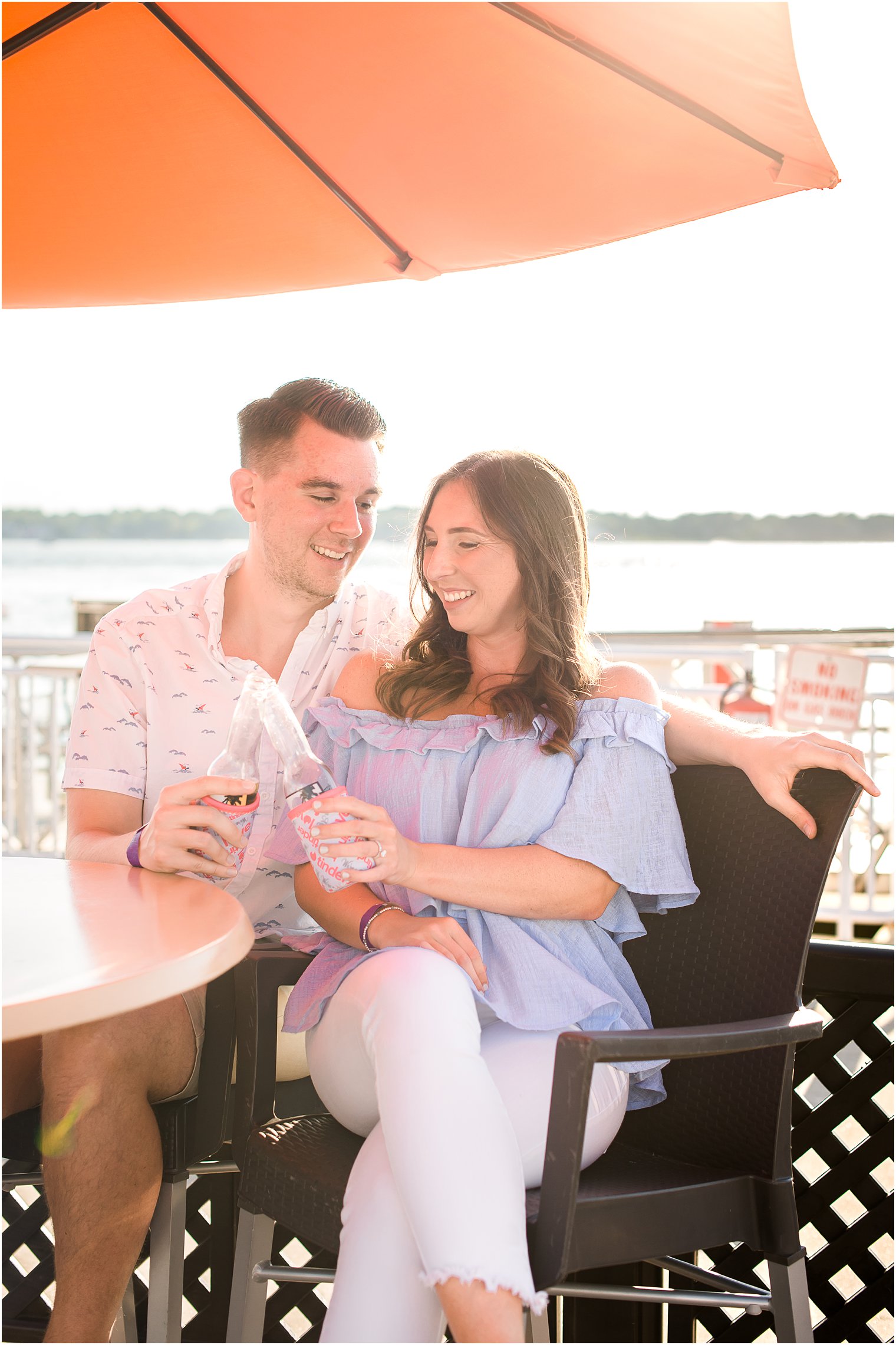 bride and groom enjoy drinks on 9th Ave Pier