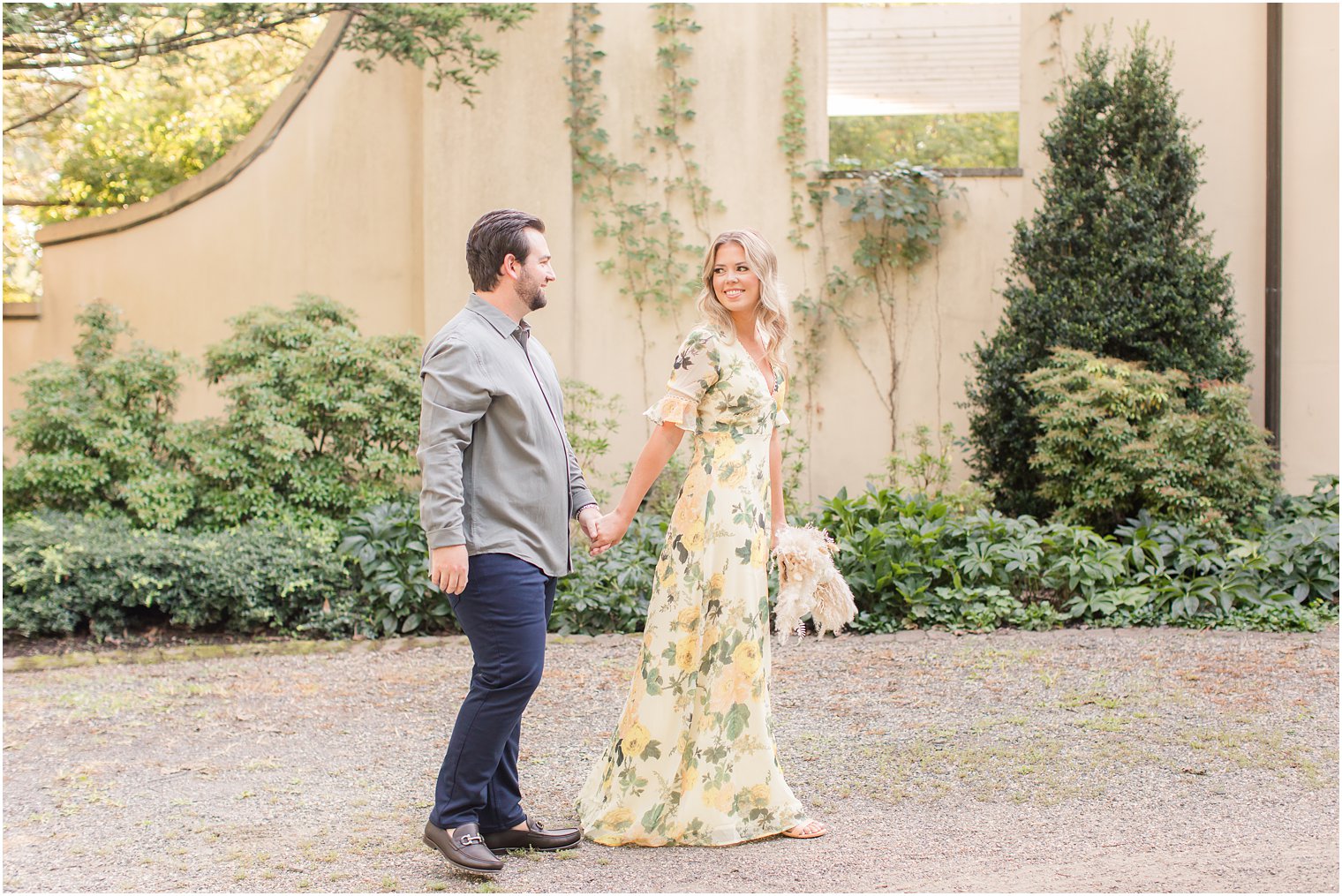 engaged couple walks through gardens in New Jersey