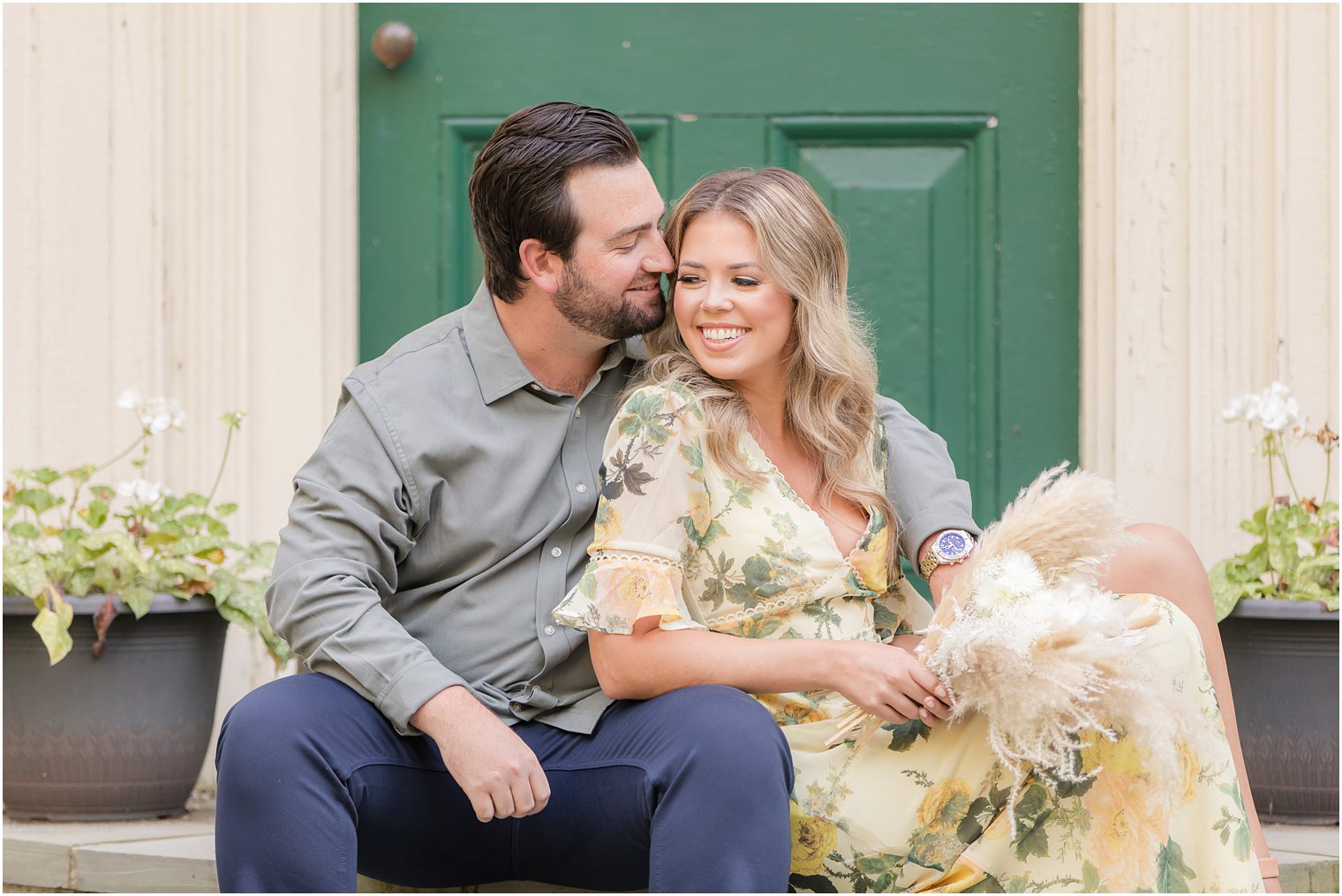 New Jersey couple sits on steps during engagement photos