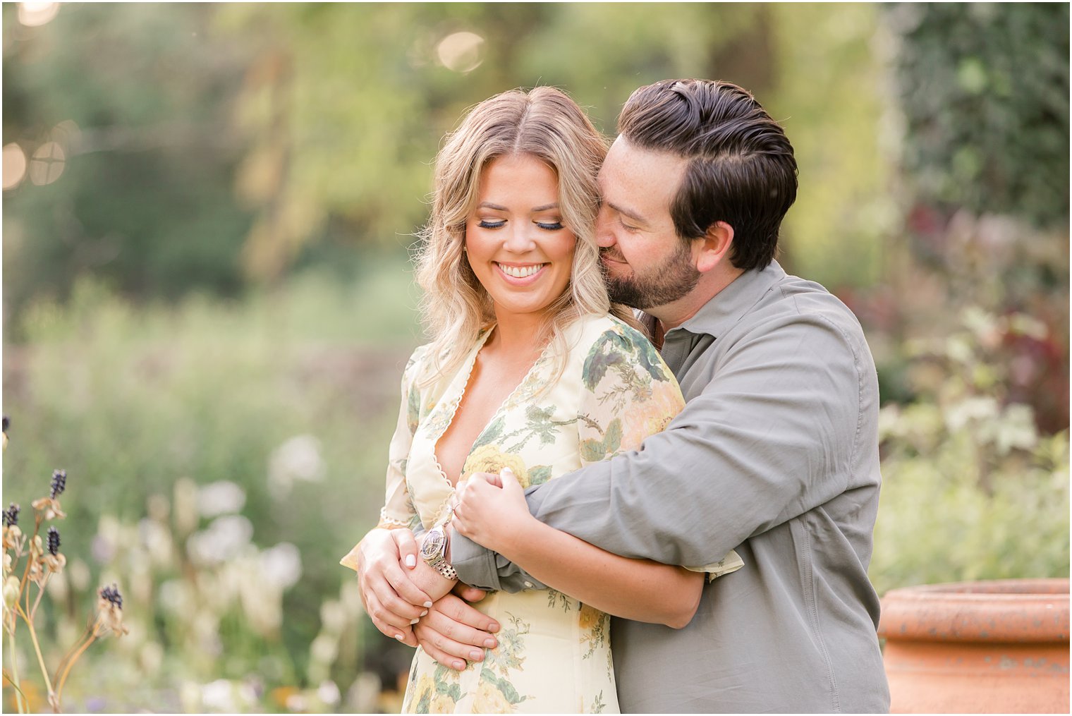 groom nuzzles bride during engagement photos in New Jersey