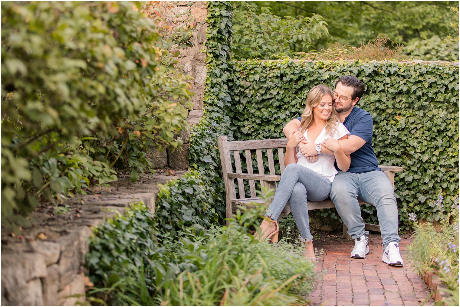 New Jersey couple sits on bench in gardens