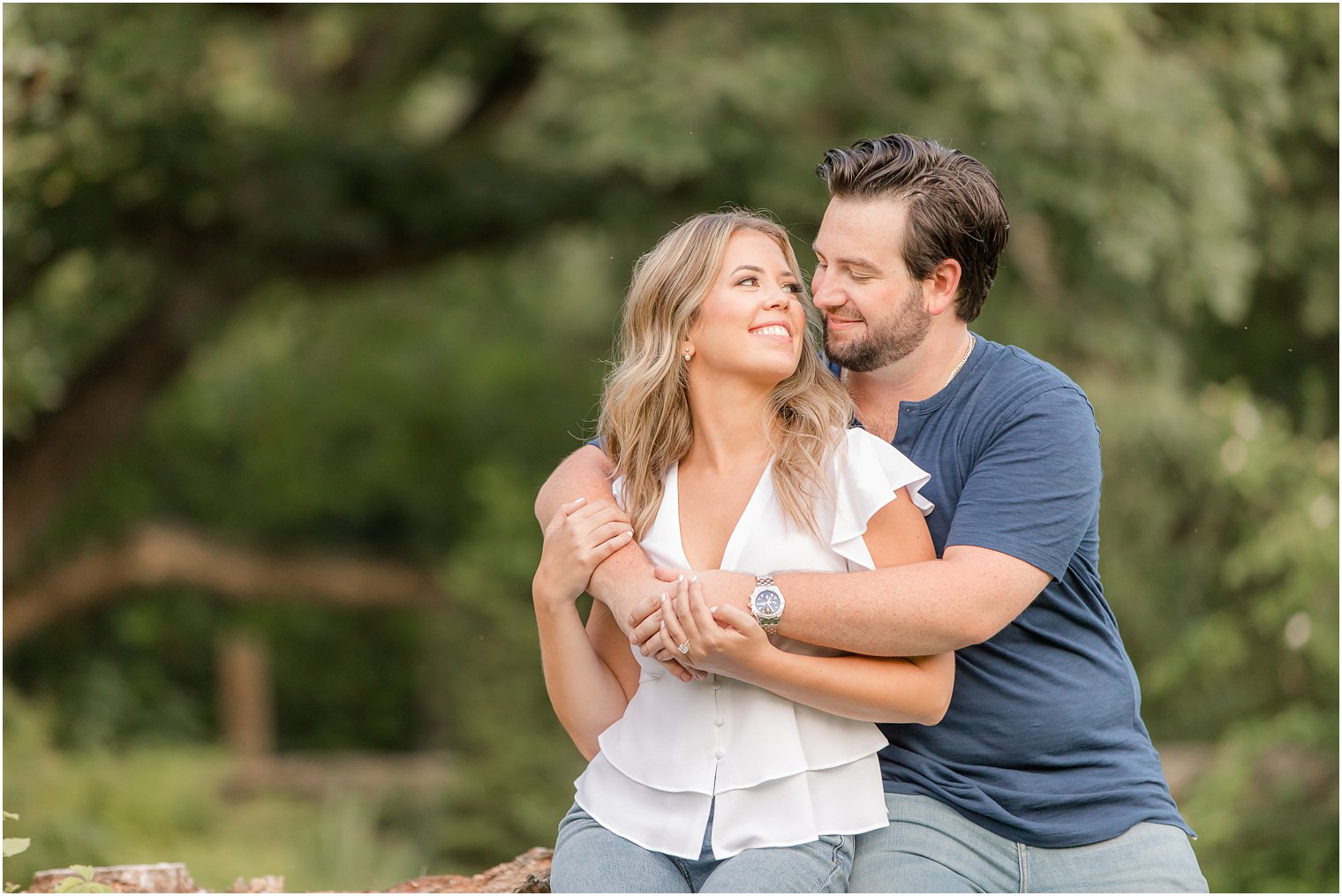 groom hugs bride-to-be during Bernardsville NJ engagement photos