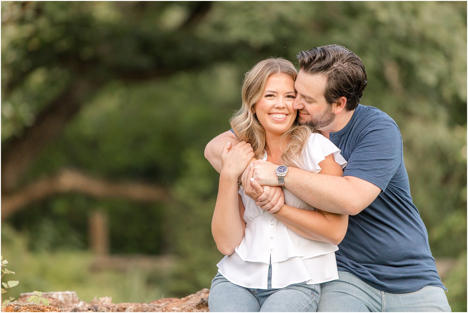 groom kisses bride's cheek during New Jersey engagement photos