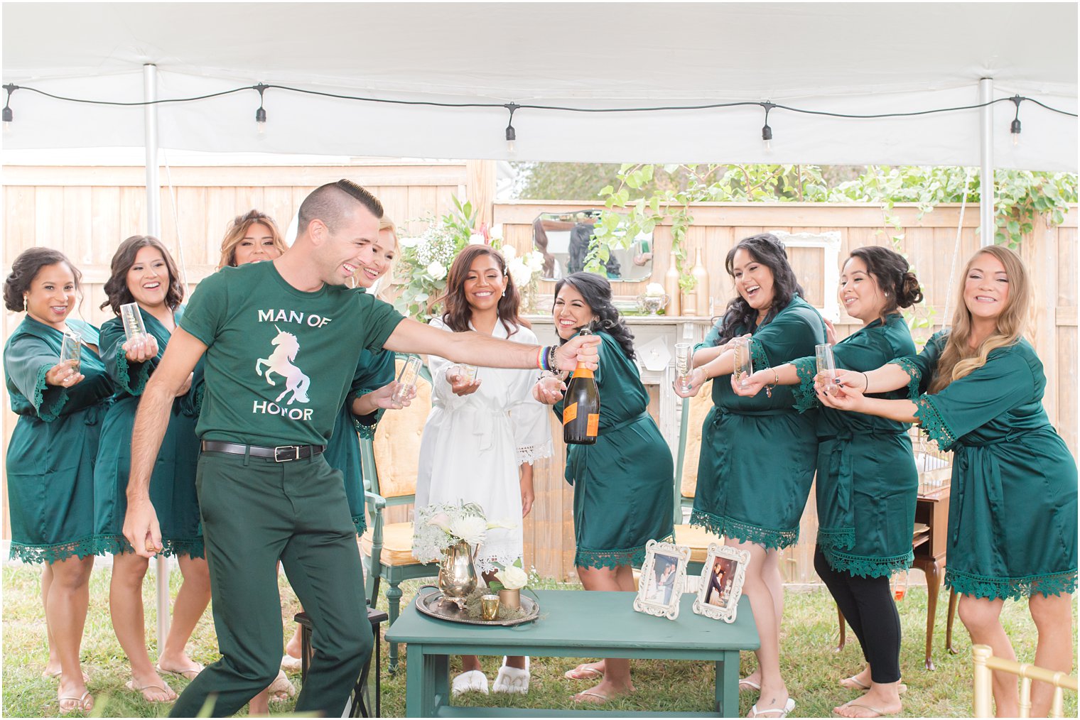 bride and bridesmaids have mimosas