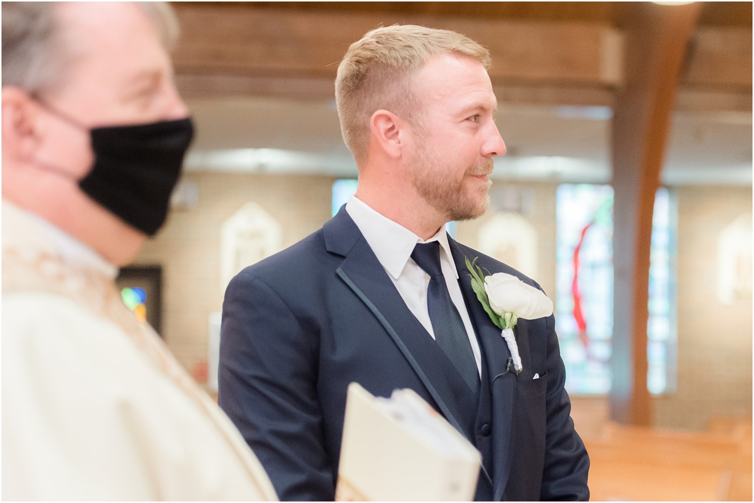 groom watches bride enter traditional Toms River NJ church wedding
