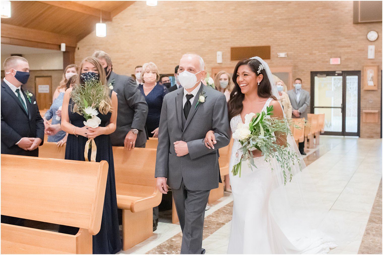 bride walks down aisle with dad during traditional Toms River NJ church wedding