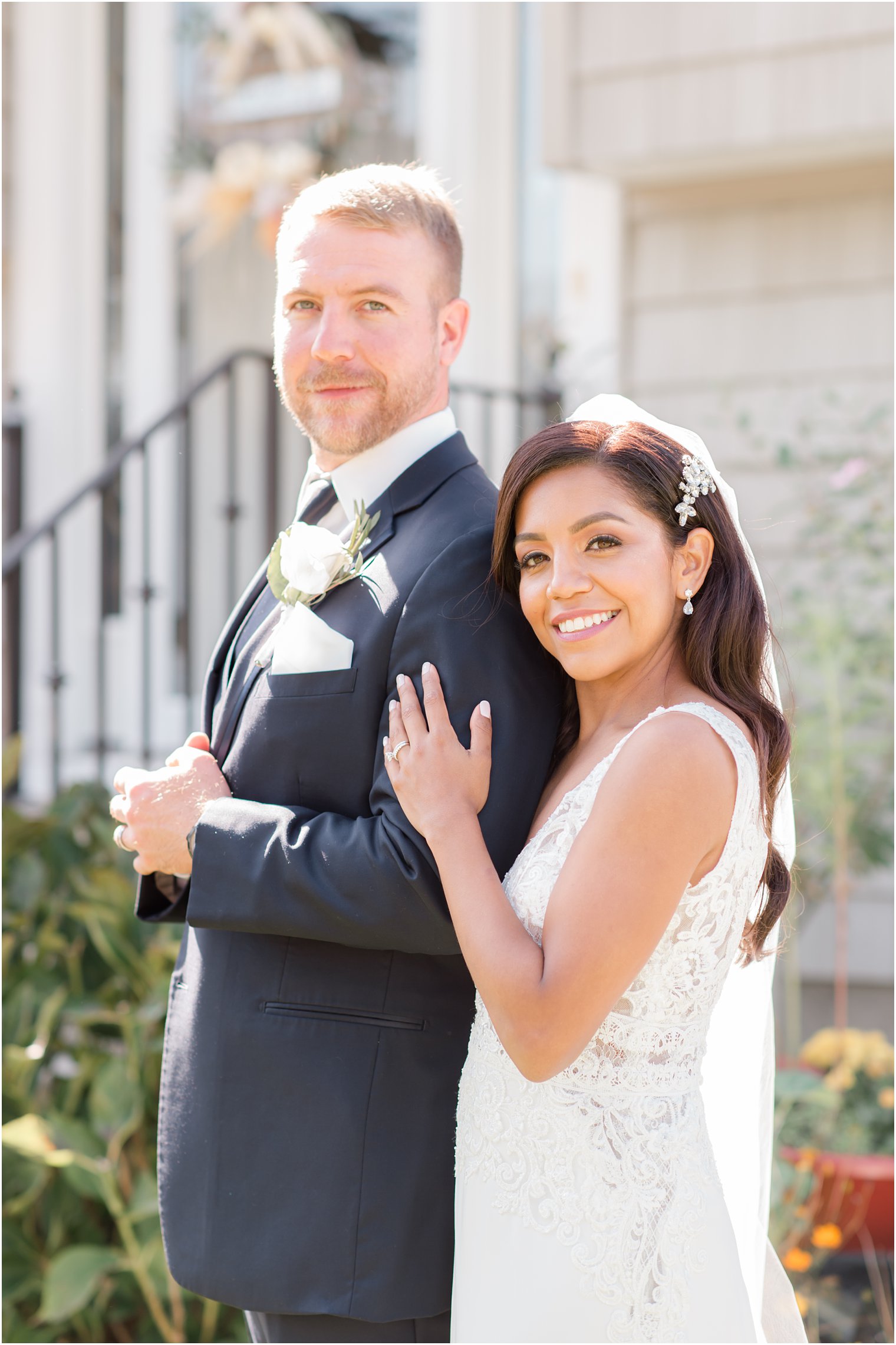 bride and groom pose outside Tom's River NJ church