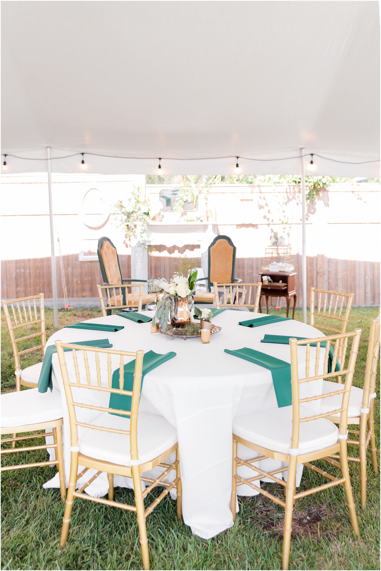 emerald and gold backyard wedding reception place settings