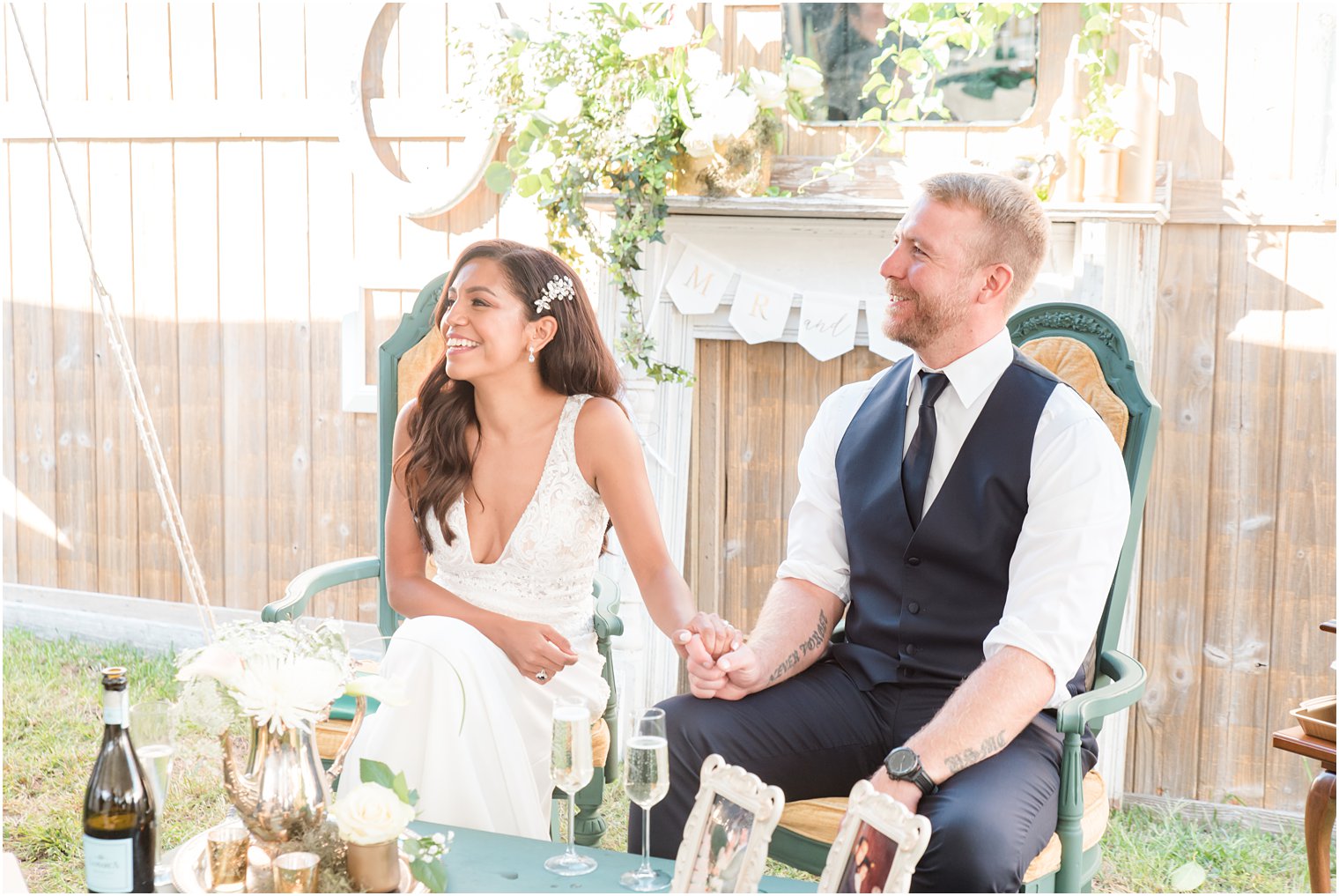 bride and groom laugh during toasts