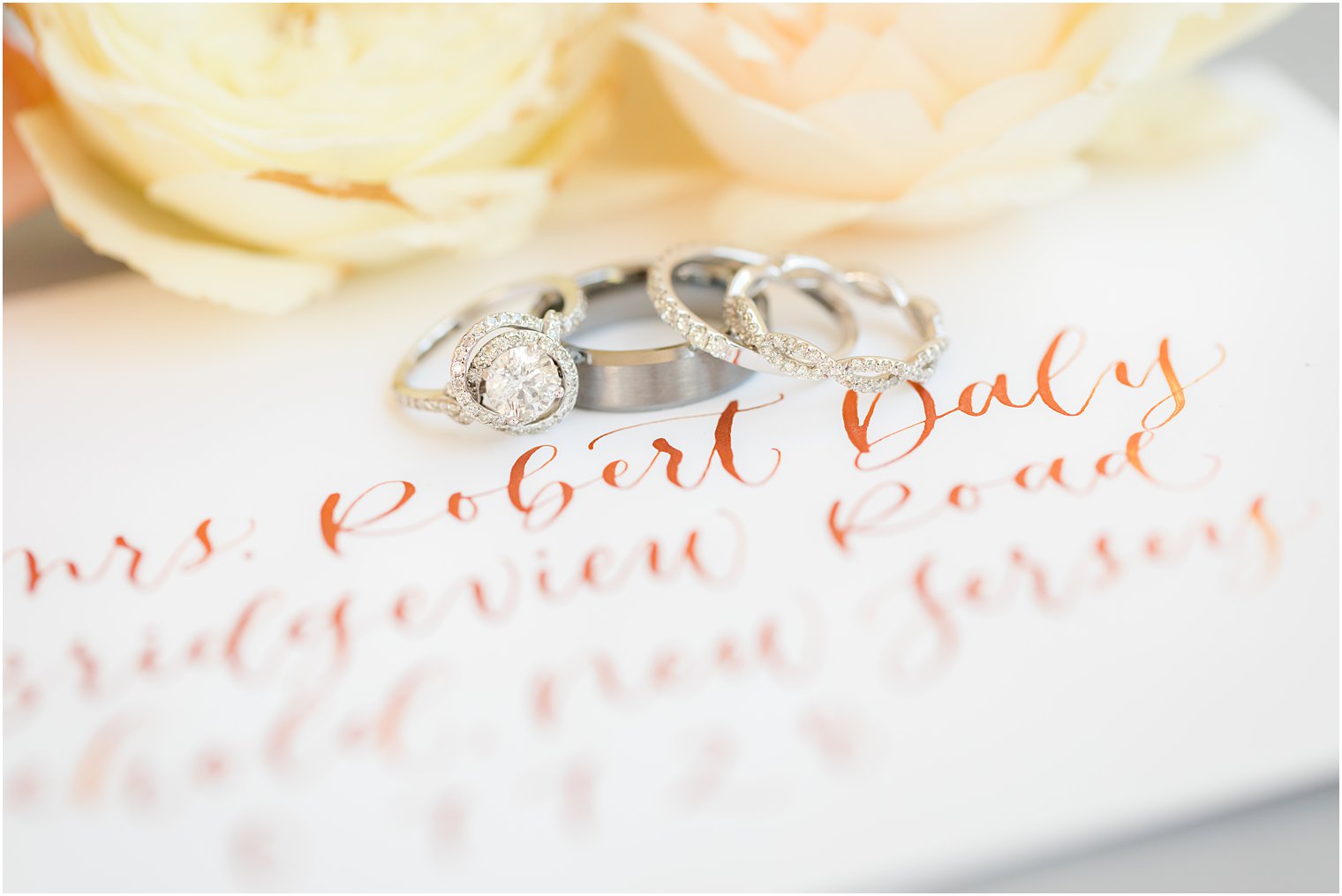 orange calligraphy on wedding invitation by The Shaded Maple