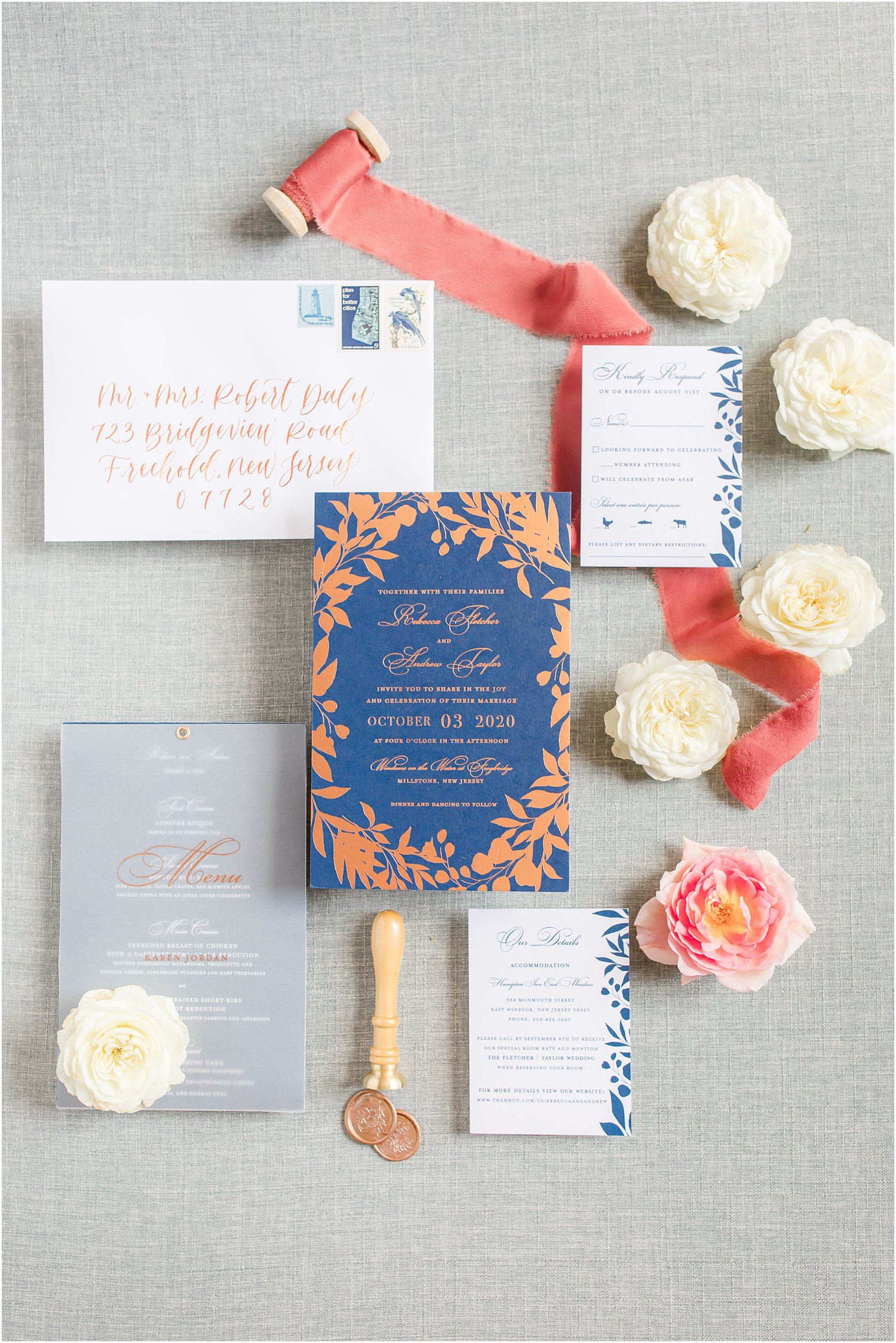 modern fall wedding suite inspiration flatlay with coral ribbon