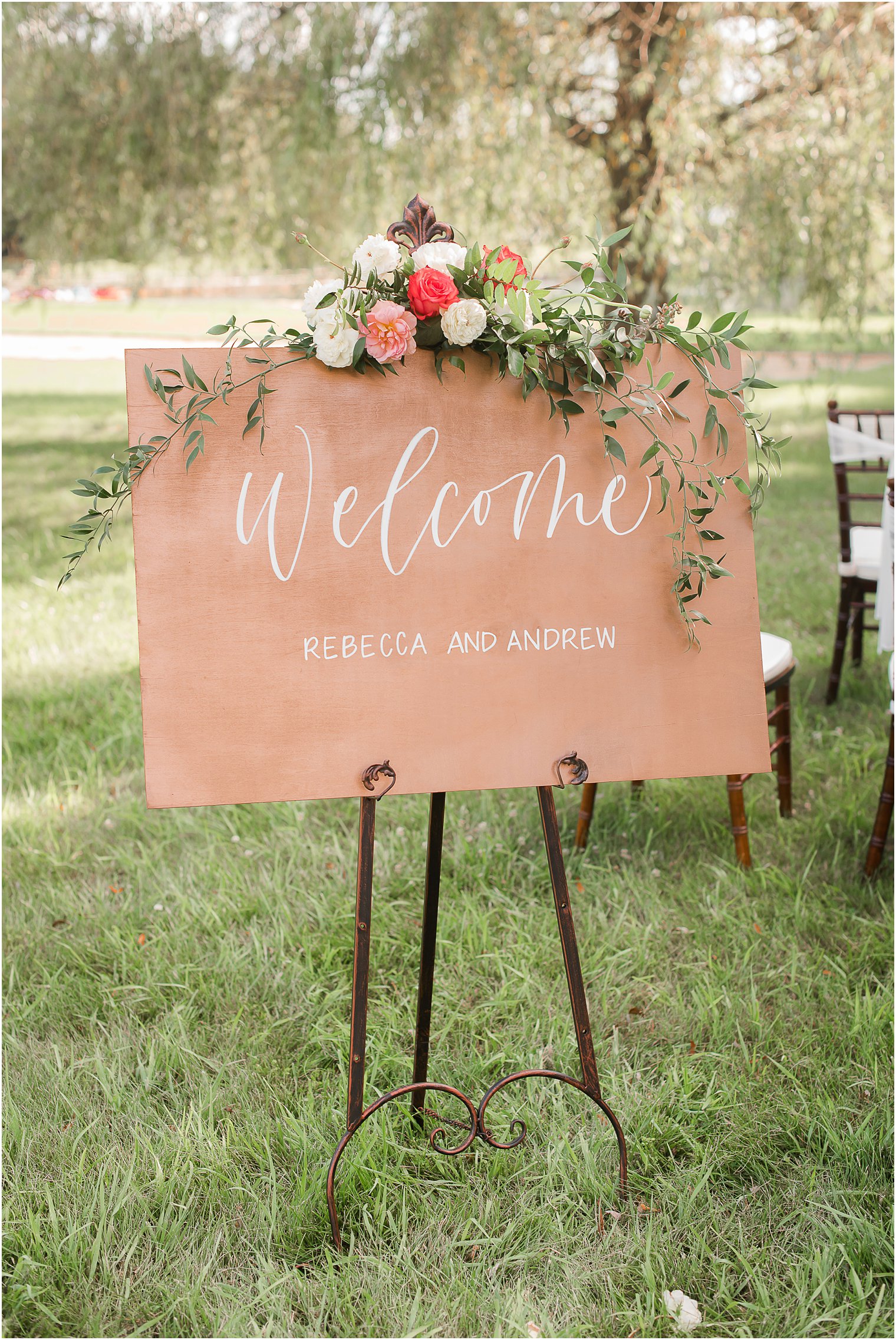 wooden sign with floral topper by The Shaded Maple and Bespoke Floral and Event Design