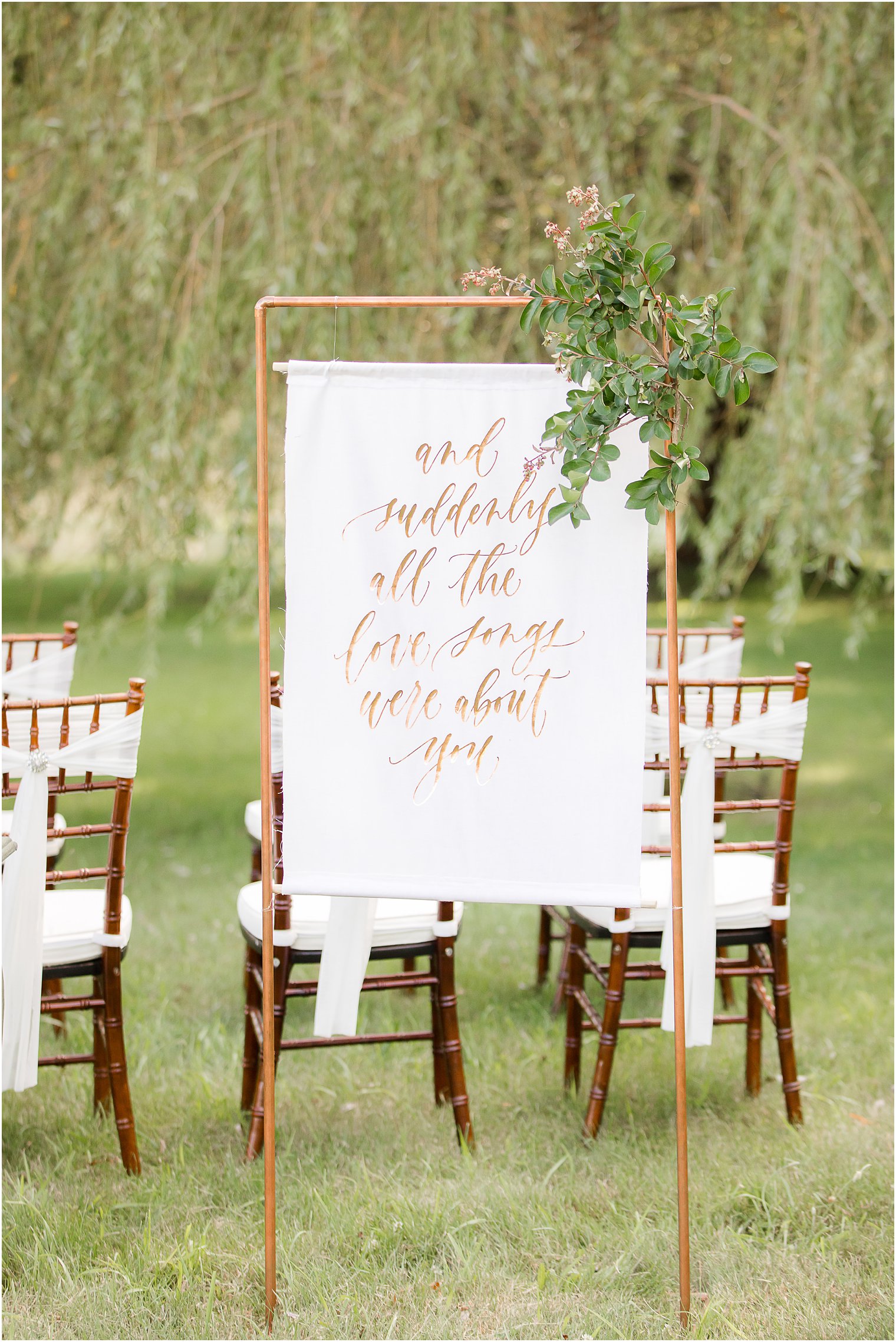 hanging sign for fall wedding ceremony with calligraphy