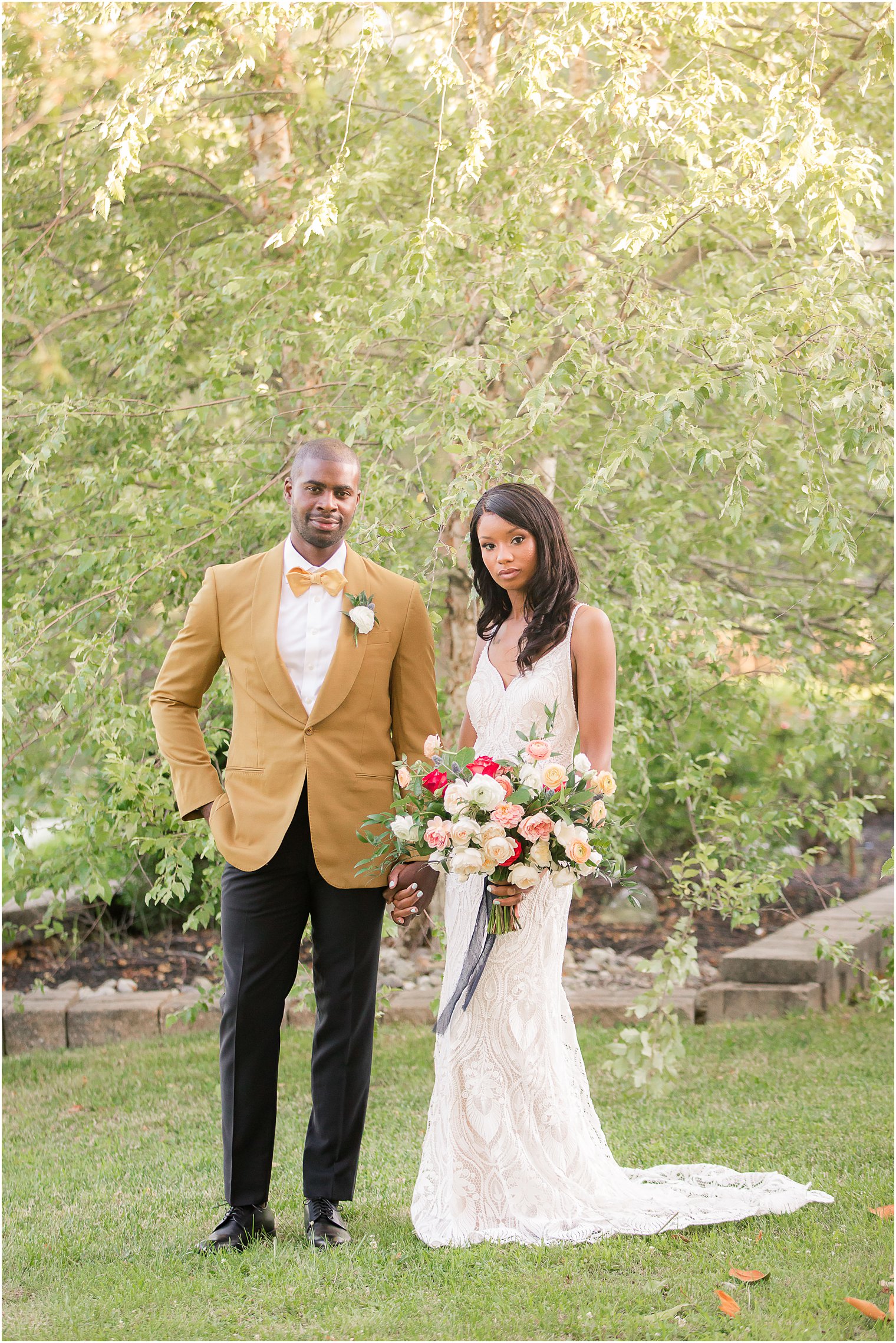 bride and groom pose during fall wedding inspiration shoot at Windows on the Water Frogbridge