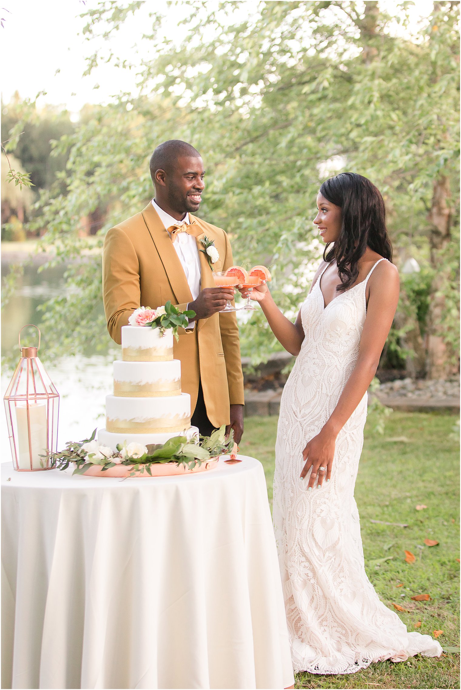 bride and groom toast before cake during during fall wedding